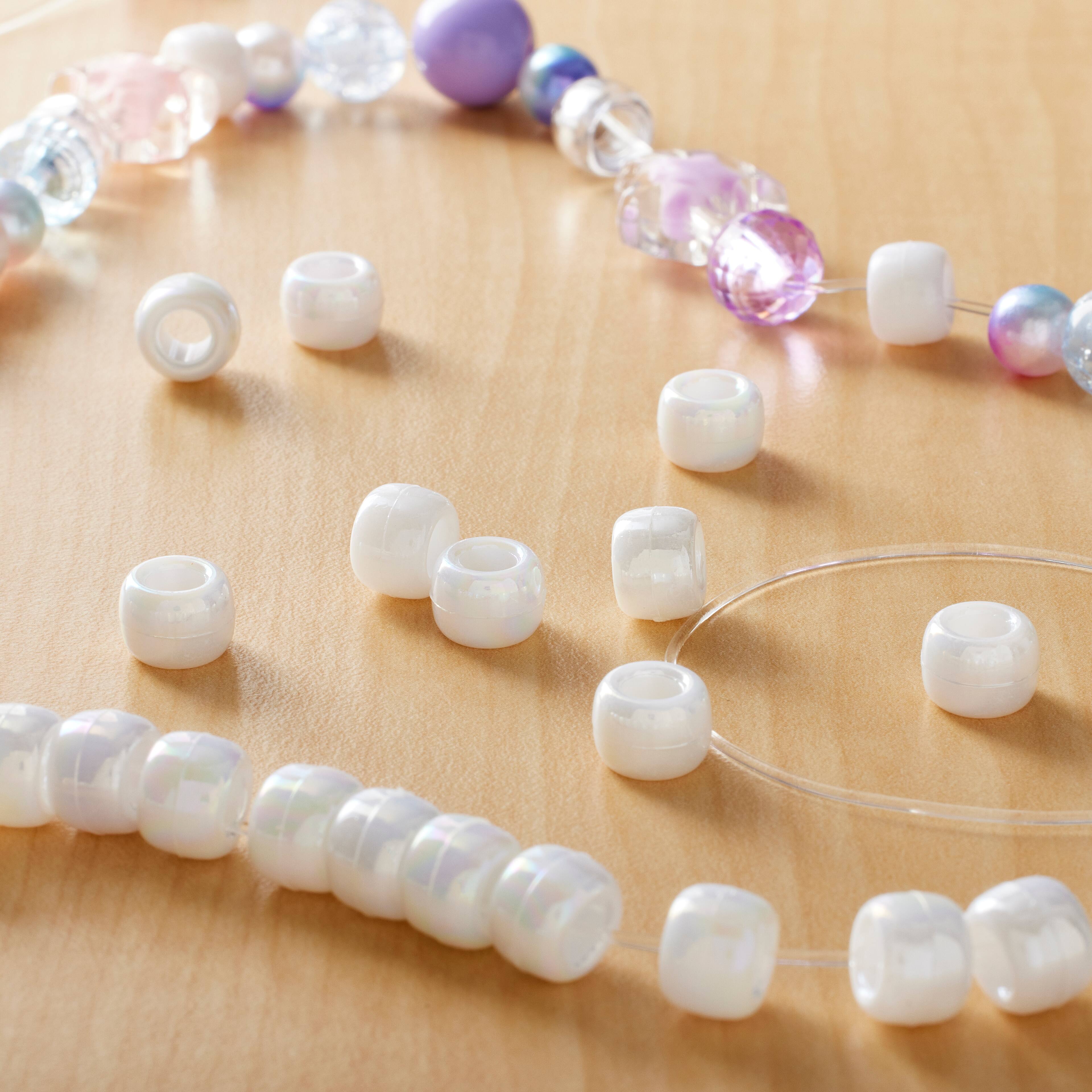 12 Packs: 280 ct. (3,360 total) Opaque White AB Pony Beads by Creatology™, 6mm x 9mm