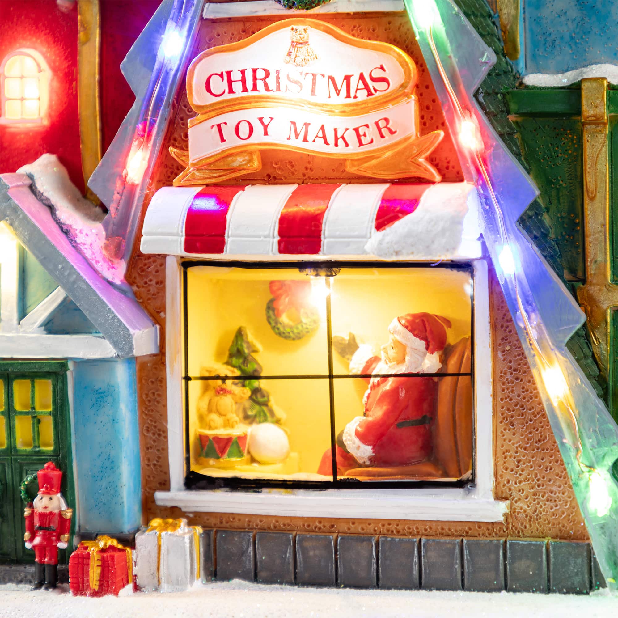 Glitzhome&#xAE; 10.75&#x22; Lighted CHRISTMAS TOY MARKET Resin Village with Movement and Music