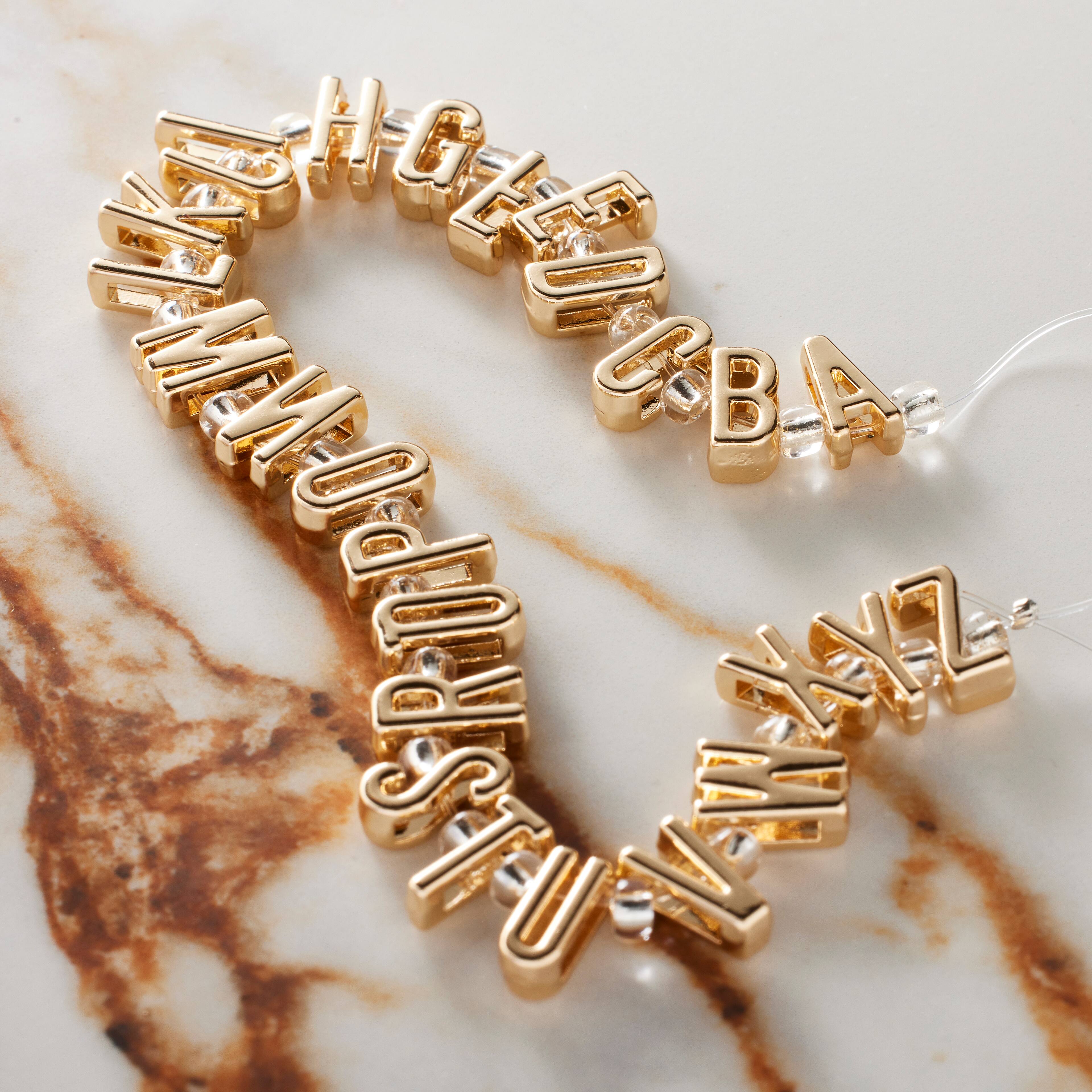 12 Packs: 26 ct. (312 total) Gold Alphabet Metal Beads by Bead Landing™