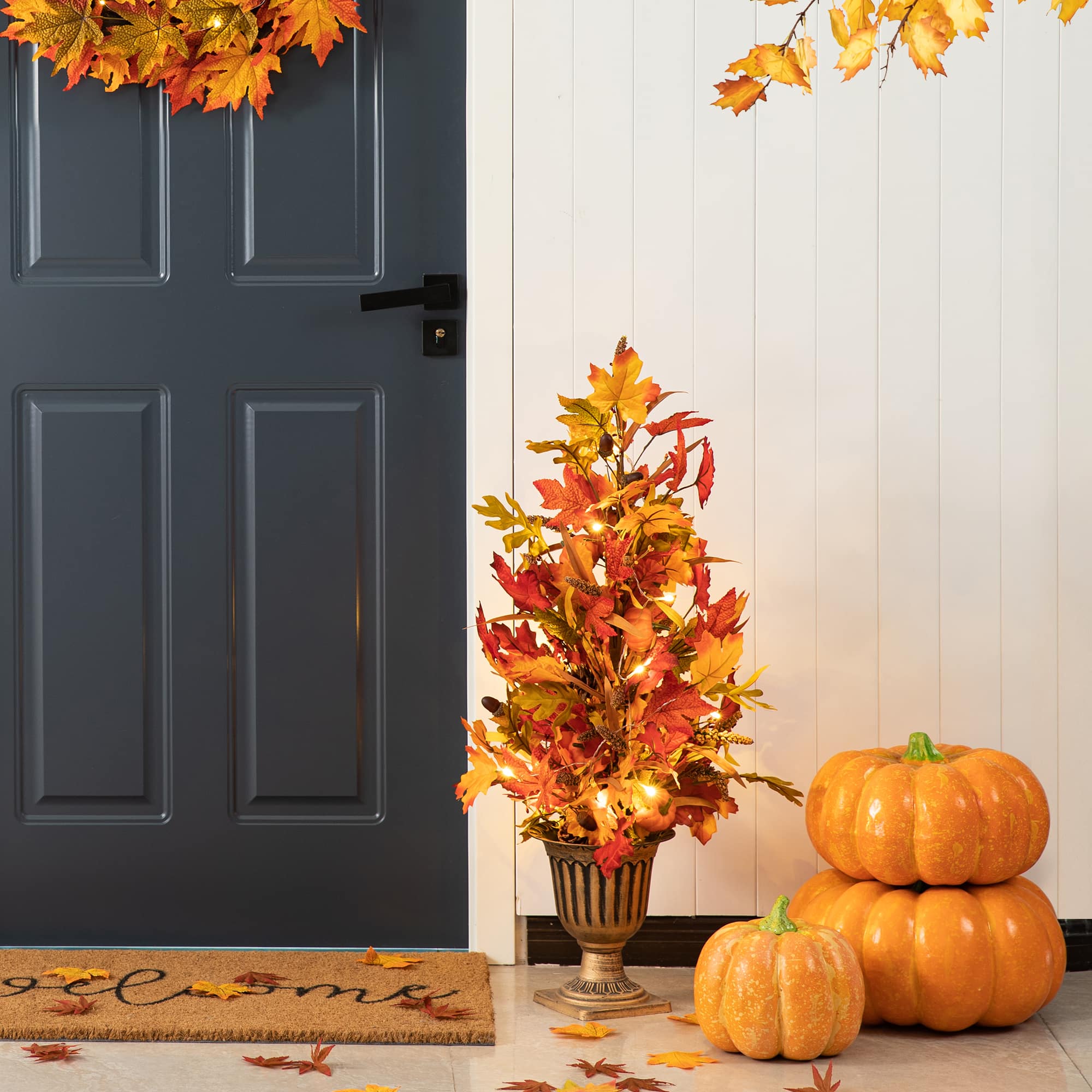 Glitzhome&#xAE; 3ft. Fall Lighted Maple Leaves Tree in Urn with Timer