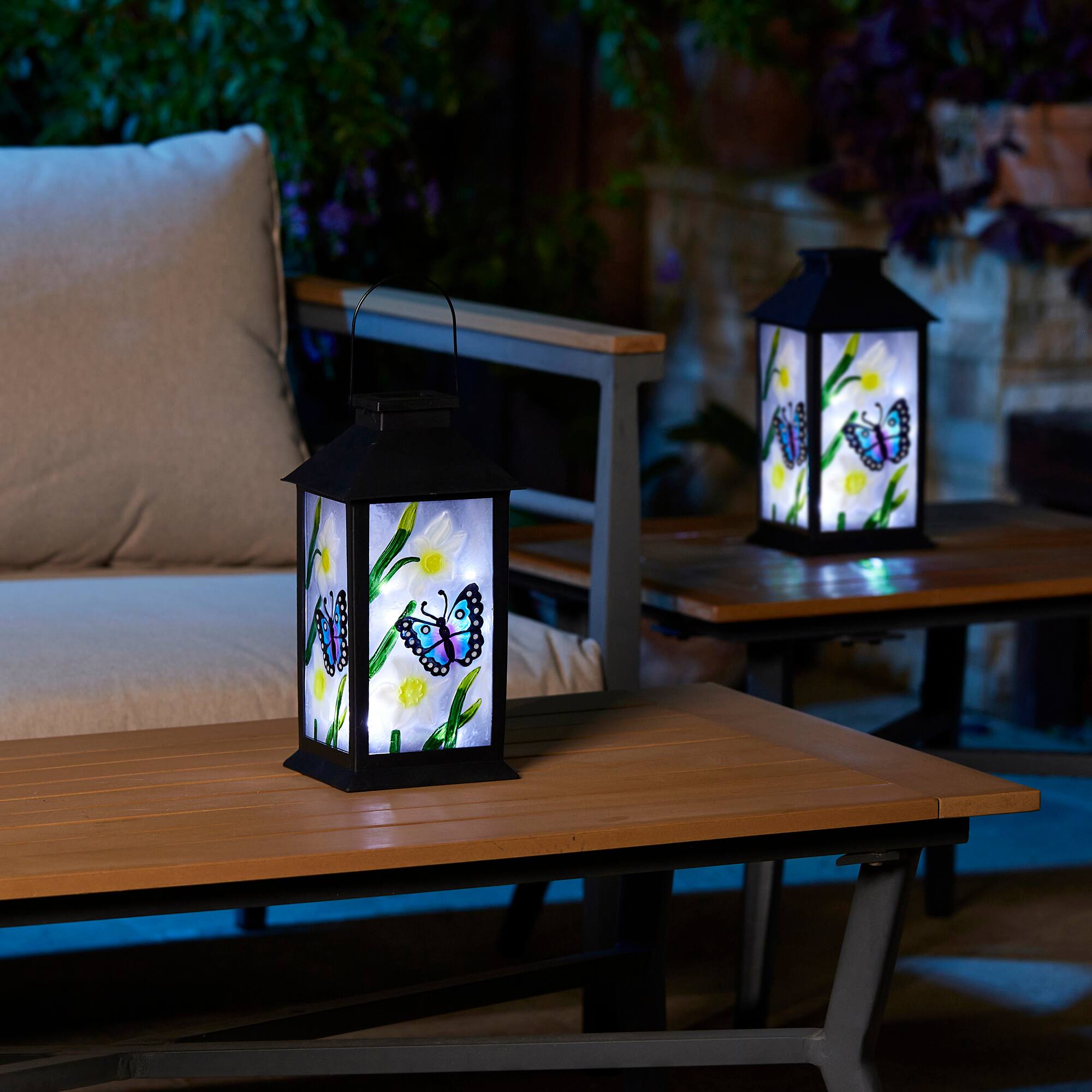 Glitzhome® 11" Glass with Butterfly & Flower Pattern Solar Powered Hanging Lanterns, 2ct.