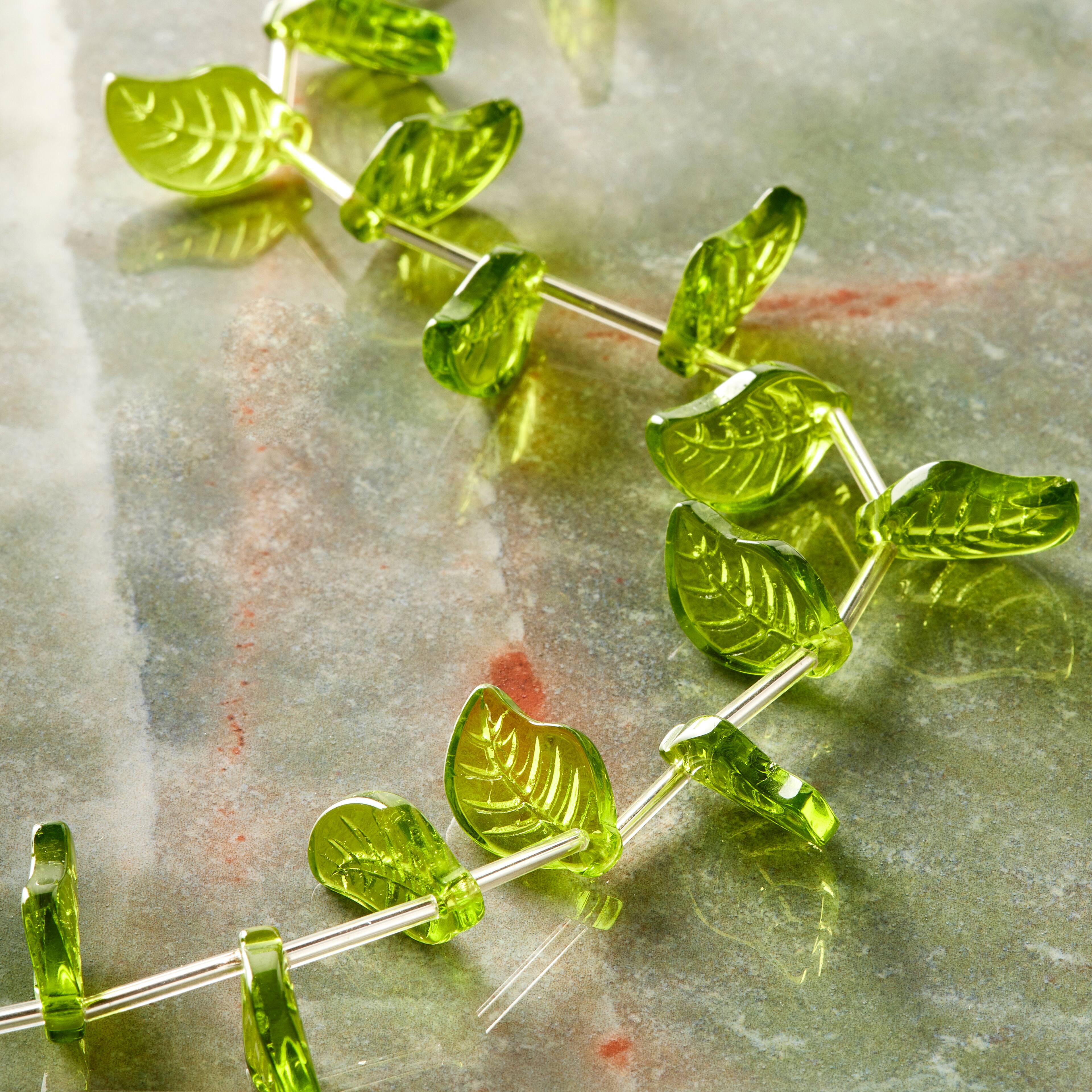 12 Pack: Peridot Green Glass Leaf Beads, 18mm by Bead Landing&#x2122;