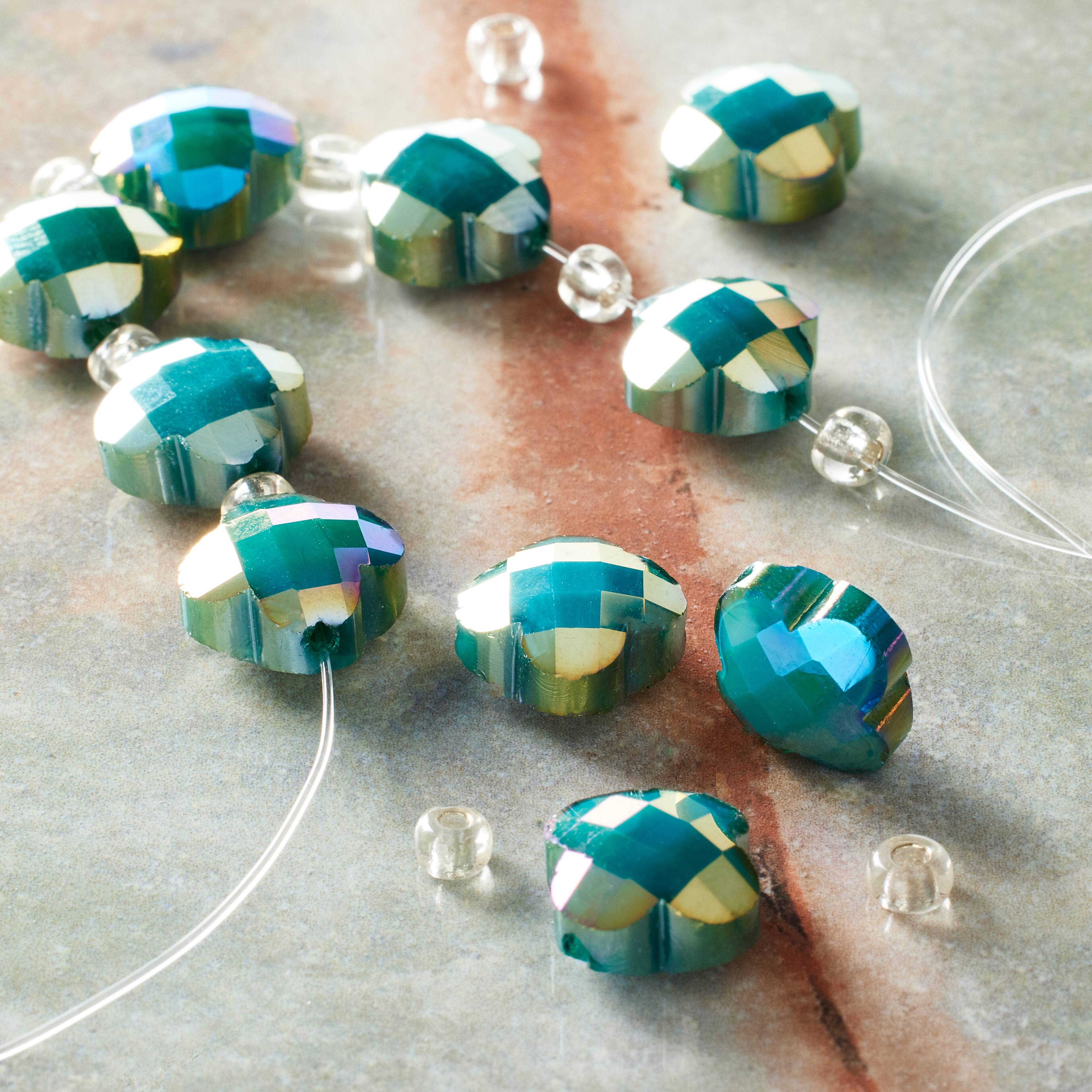 12 Pack: 12mm Turquoise Glass Cross Faceted Beads by Bead Landing&#x2122;
