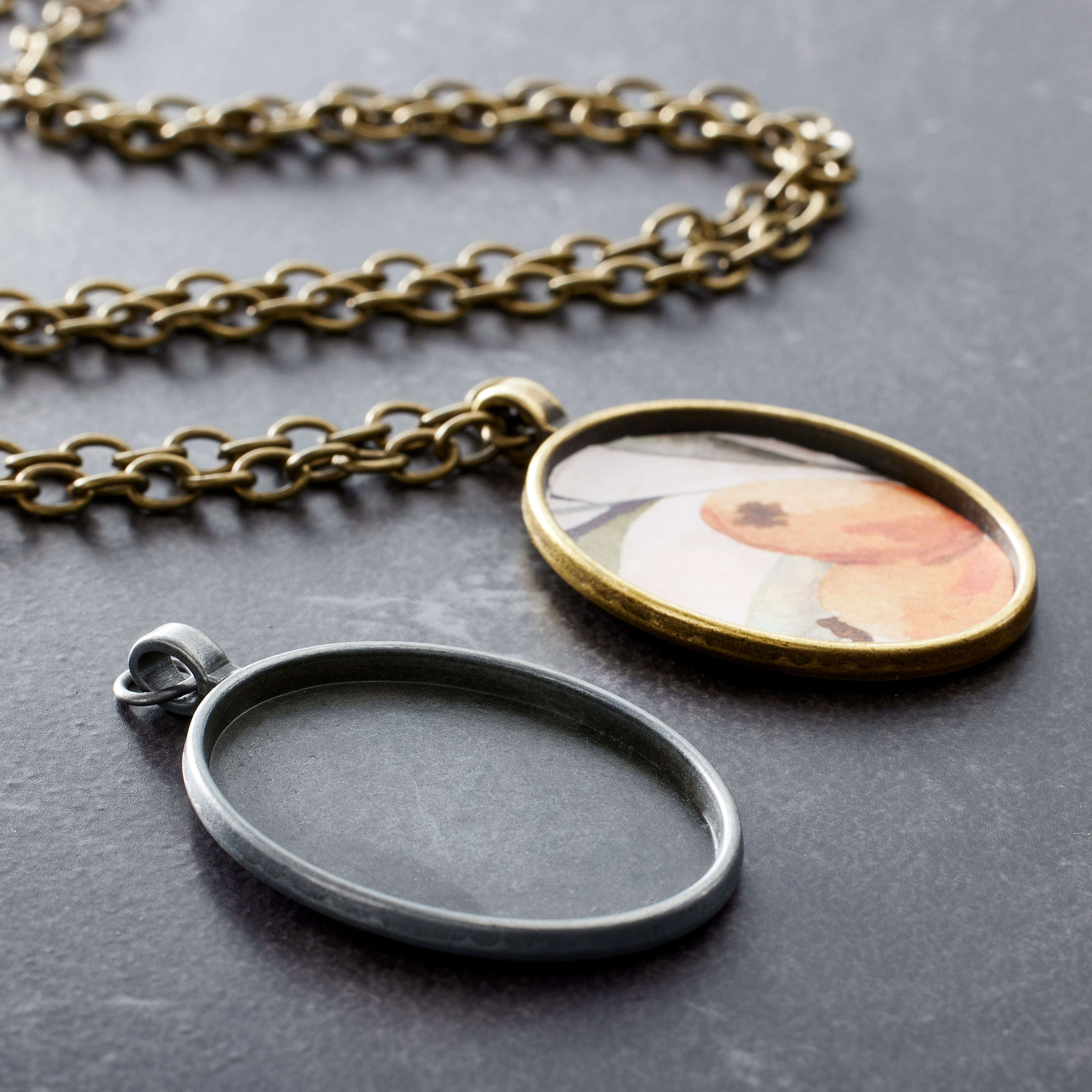 Found Objects&#x2122; Silver &#x26; Gold Oval Frame Pendants by Bead Landing&#x2122;