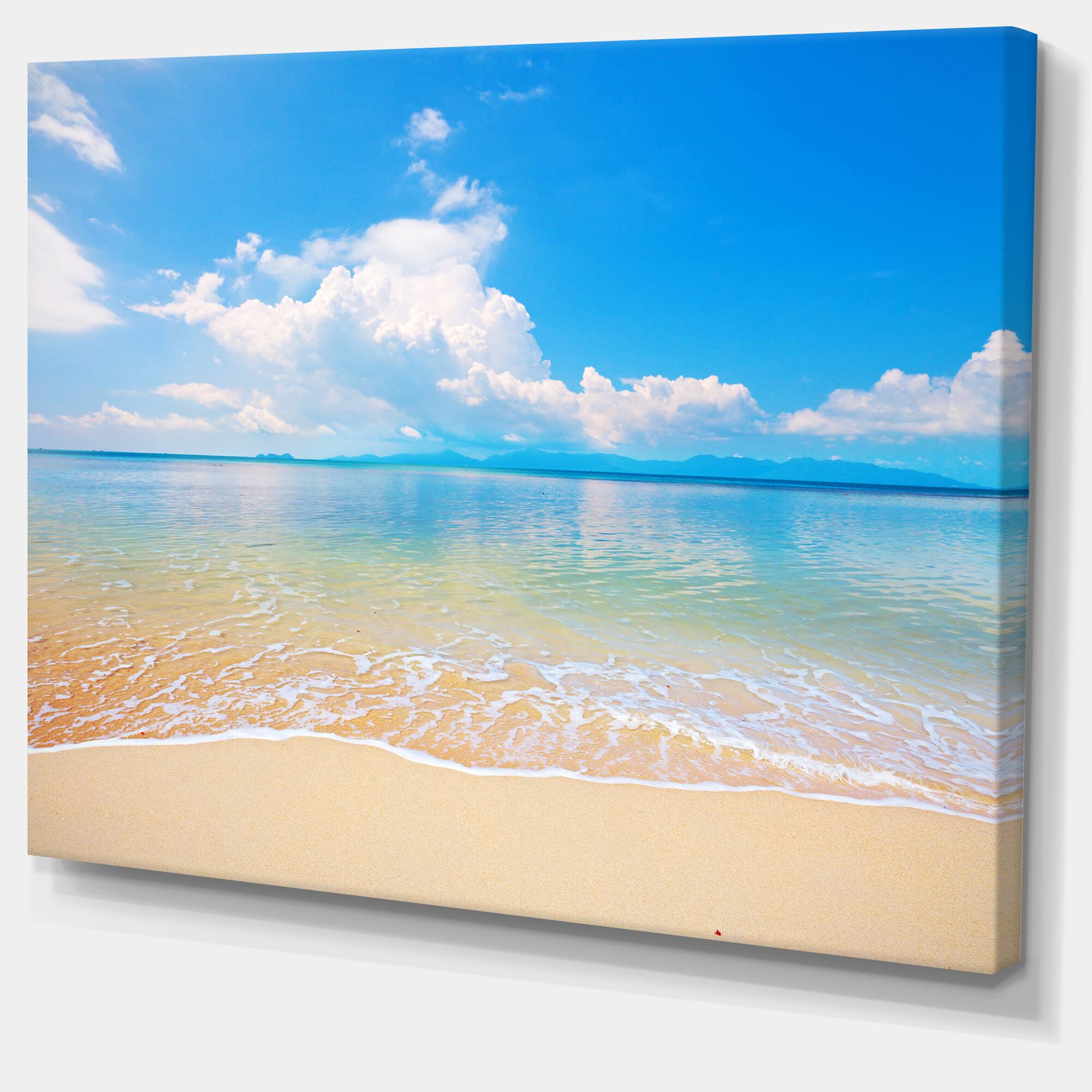 Designart - Large Clouds Over Calm Beach - Seashore Photo Canvas Print