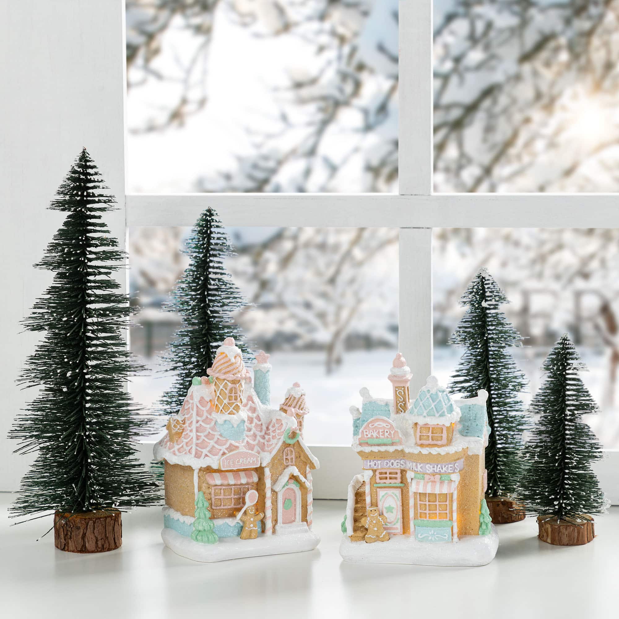 Glitzhome&#xAE; 7&#x22; Christmas Macaron Resin Village Table Decor Set