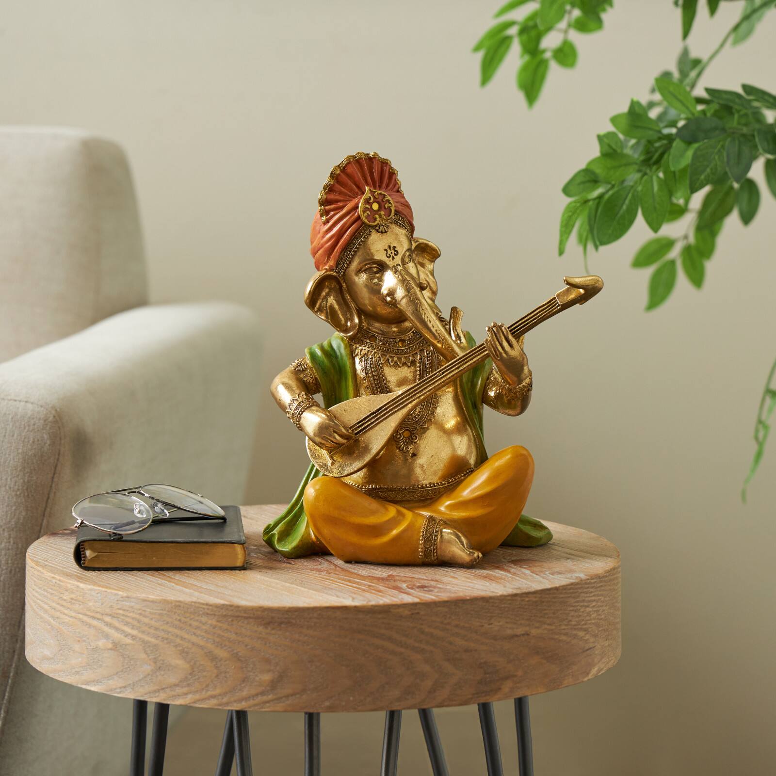10.75" Gold Ganesh Musician Decorative Sculpture with Green, Yellow, and Red Accents