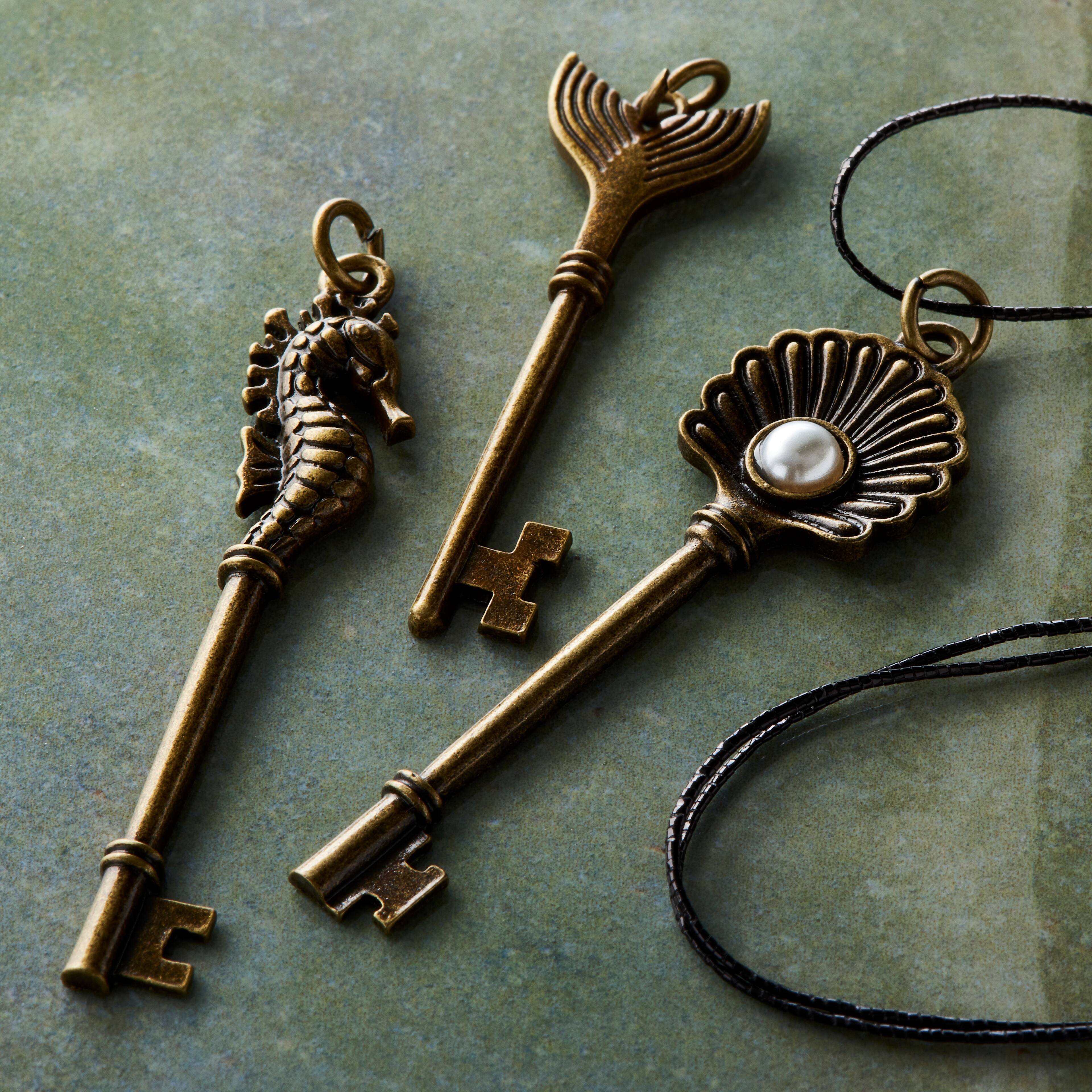 12 Packs: 3 ct. (36 total) Found Objects Oxidized Brass Sea Life Key Charms by Bead Landing&#x2122;