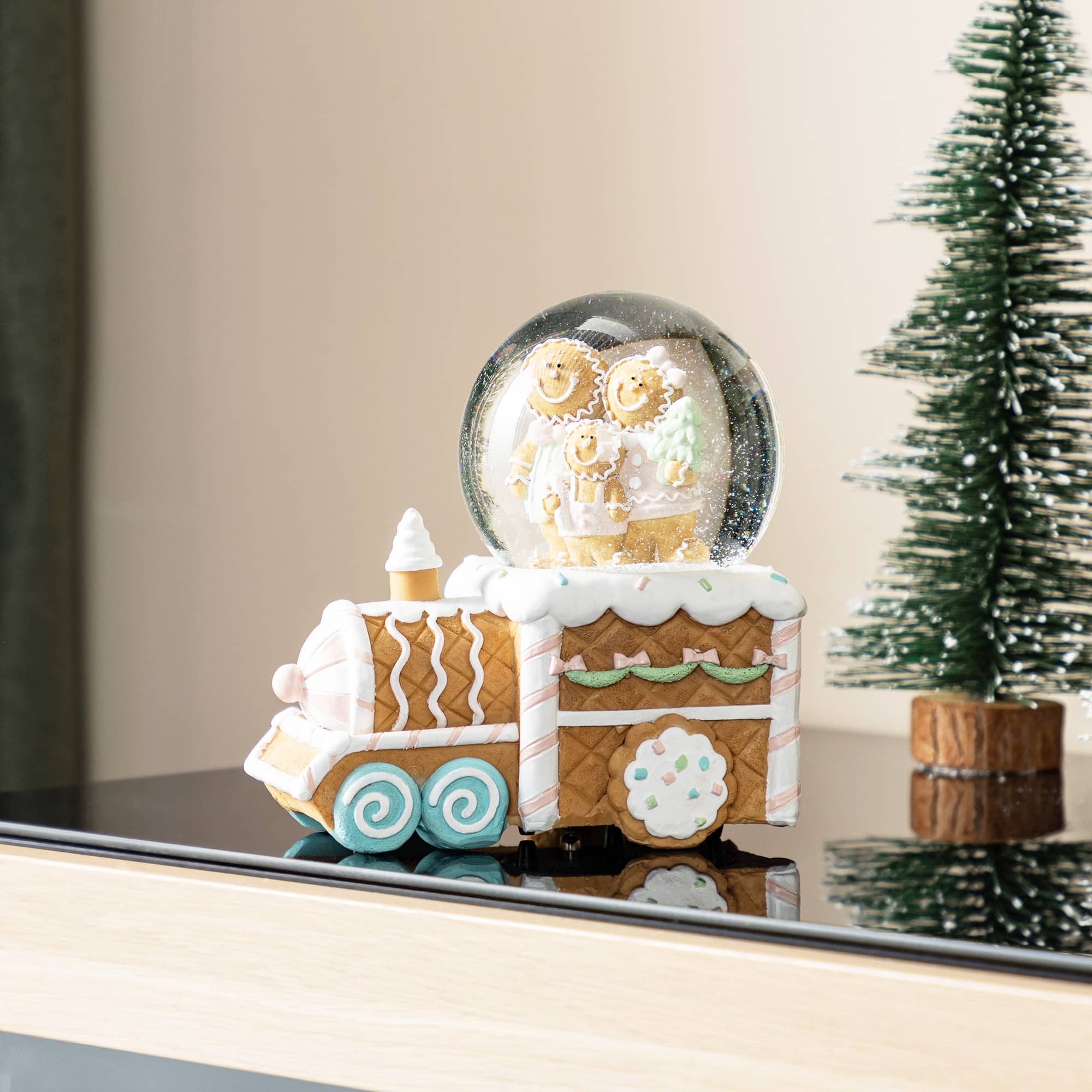 Glitzhome&#xAE; 100mm Christmas Resin Musical Snowflakes Ginginerbread Family Train Waterglobe