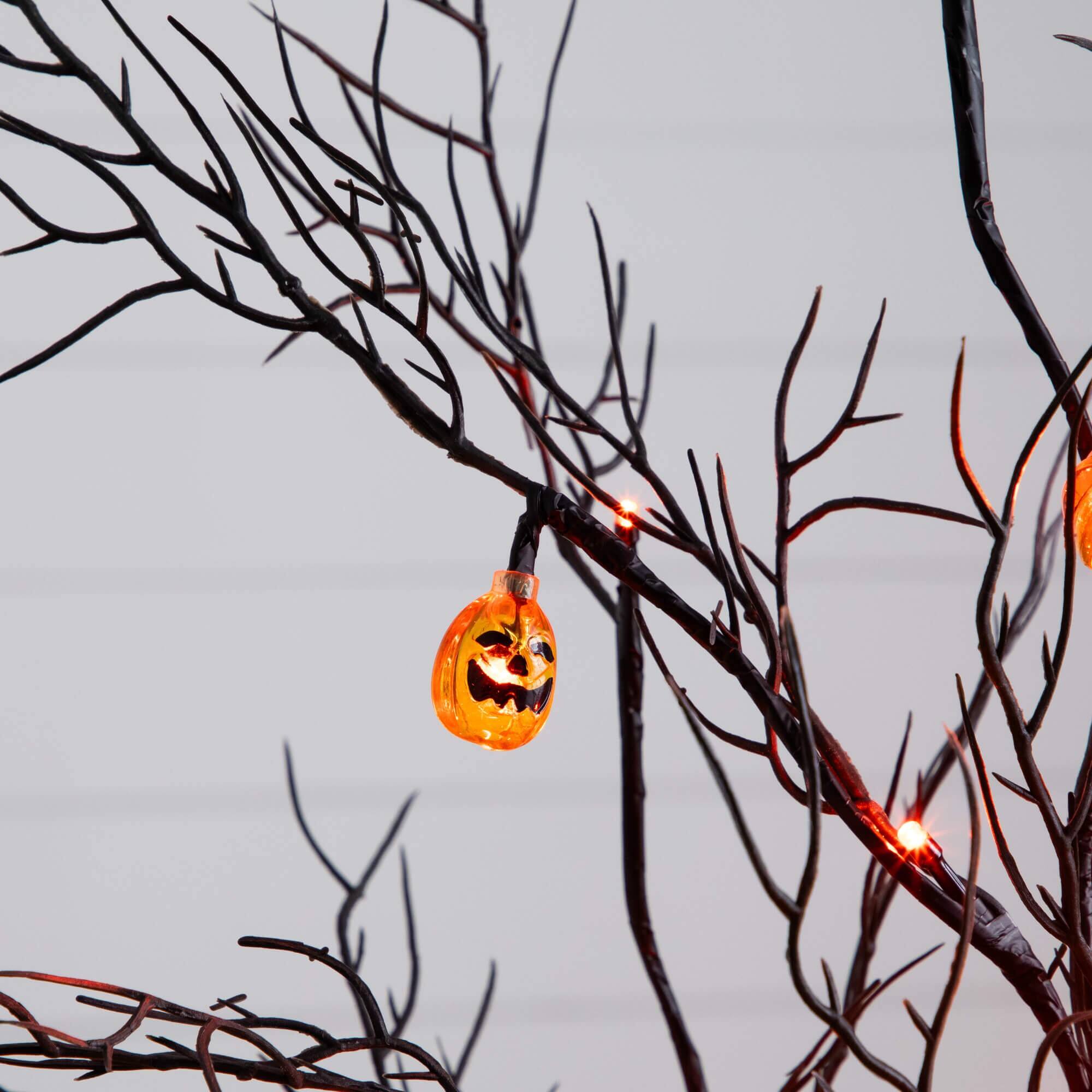 4ft. Pre-Lit Artificial Halloween Black Twig Tree with 24 Orange LED Pumpkin Shaped Lights