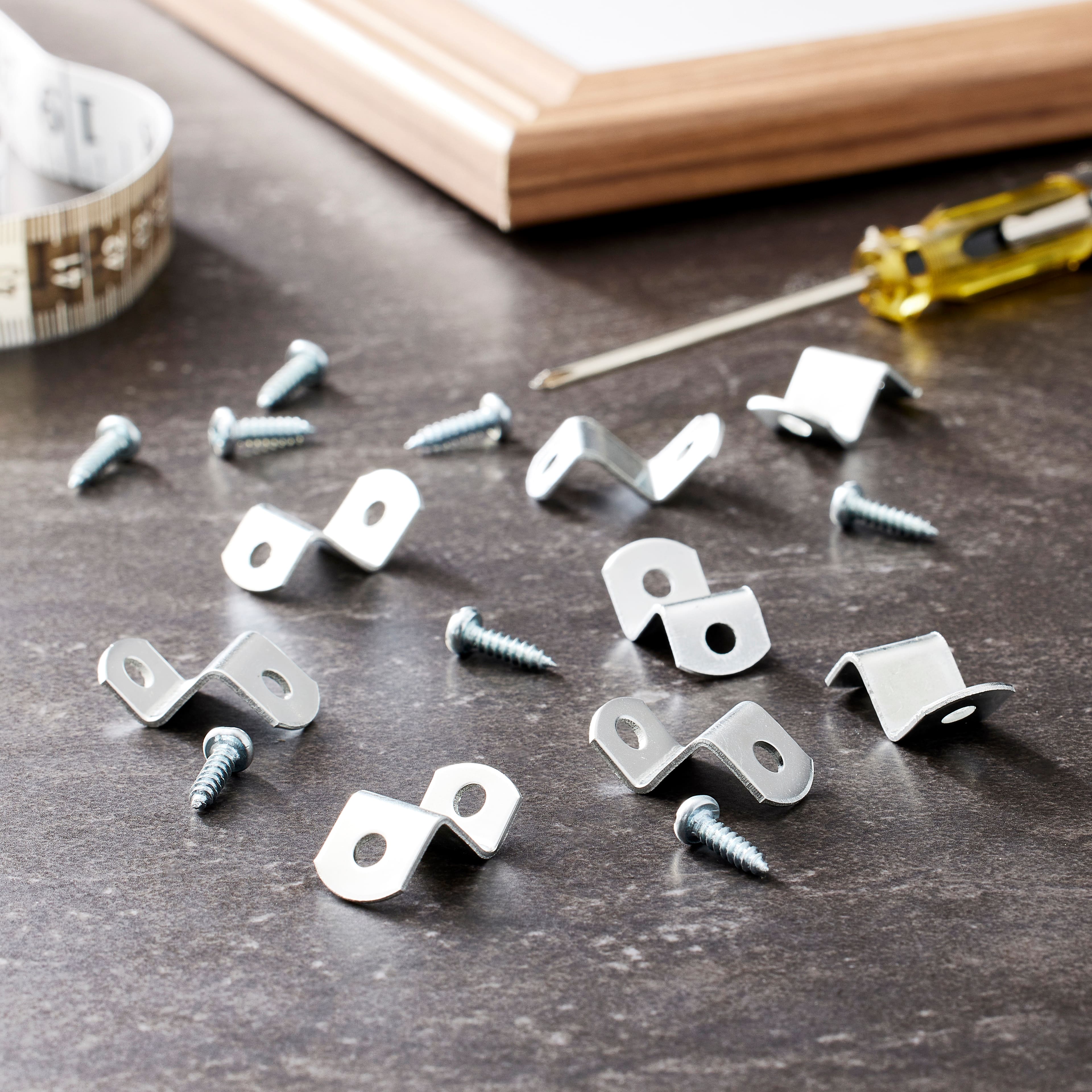 1/8 inch Offset Clips used to attach artwork to a picture frame