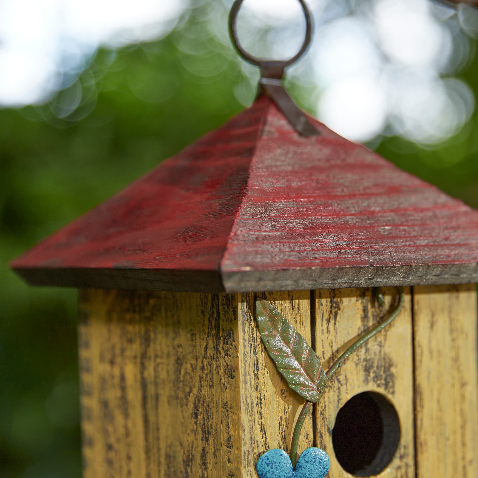 Glitzhome® 11.75" Yellow Washed 3D Metal Flowers Distressed Wood Cottage Birdhouse