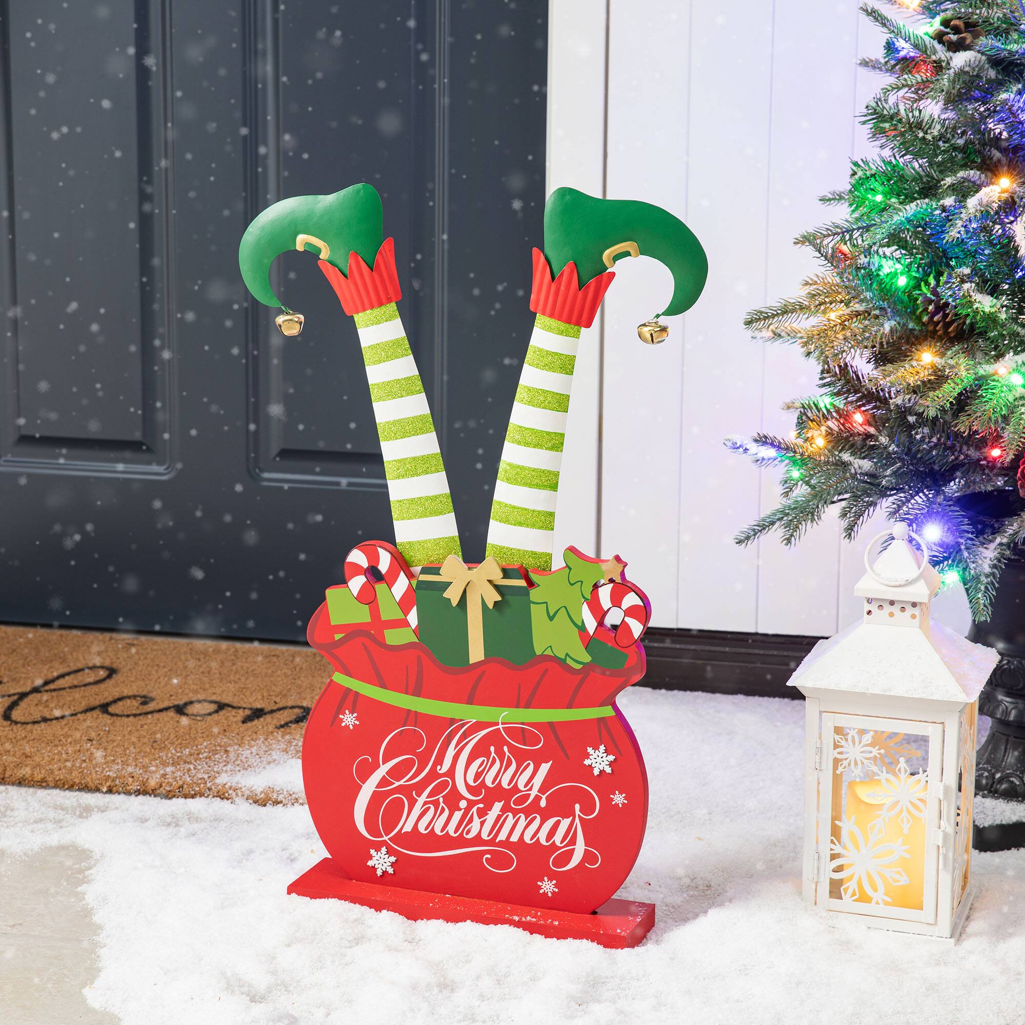 Glitzhome® 2ft. Wood & Metal Elf Legs in Gift Box Porch Décor