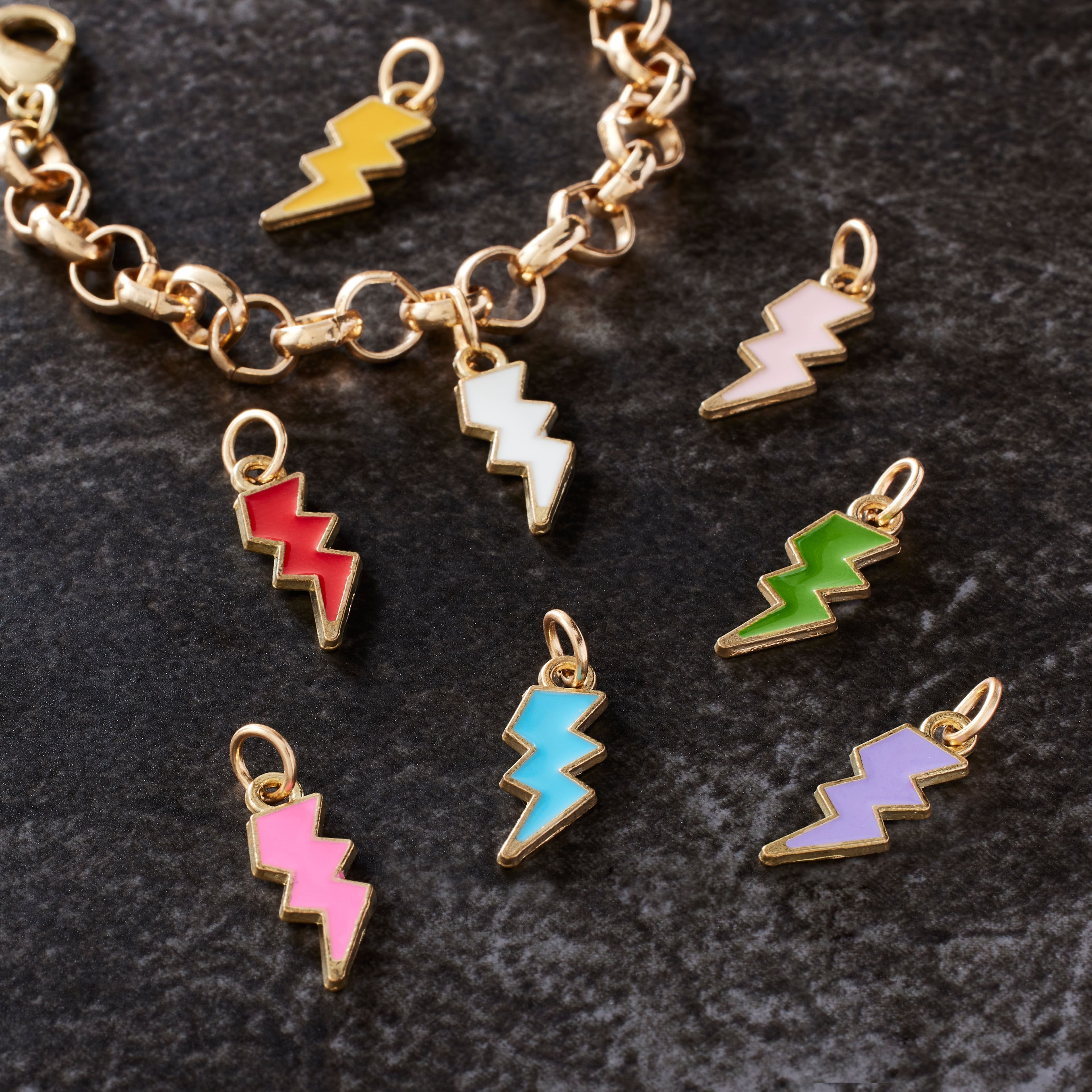 12 Packs: 8 ct. (96 total) Enamel & Gold Lightning Bolt Charms by Bead Landing™