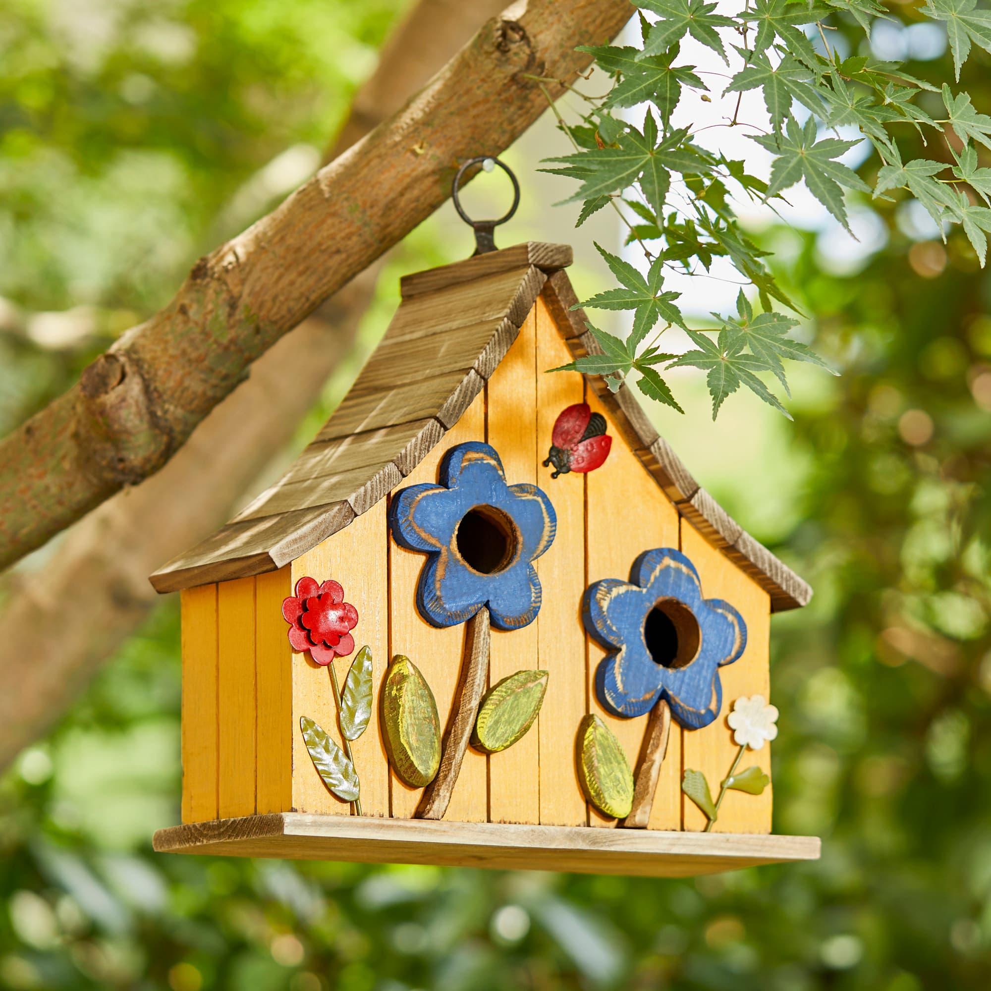 Glitzhome® 10.5" Yellow Distressed Wood Birdhouse with Flowers