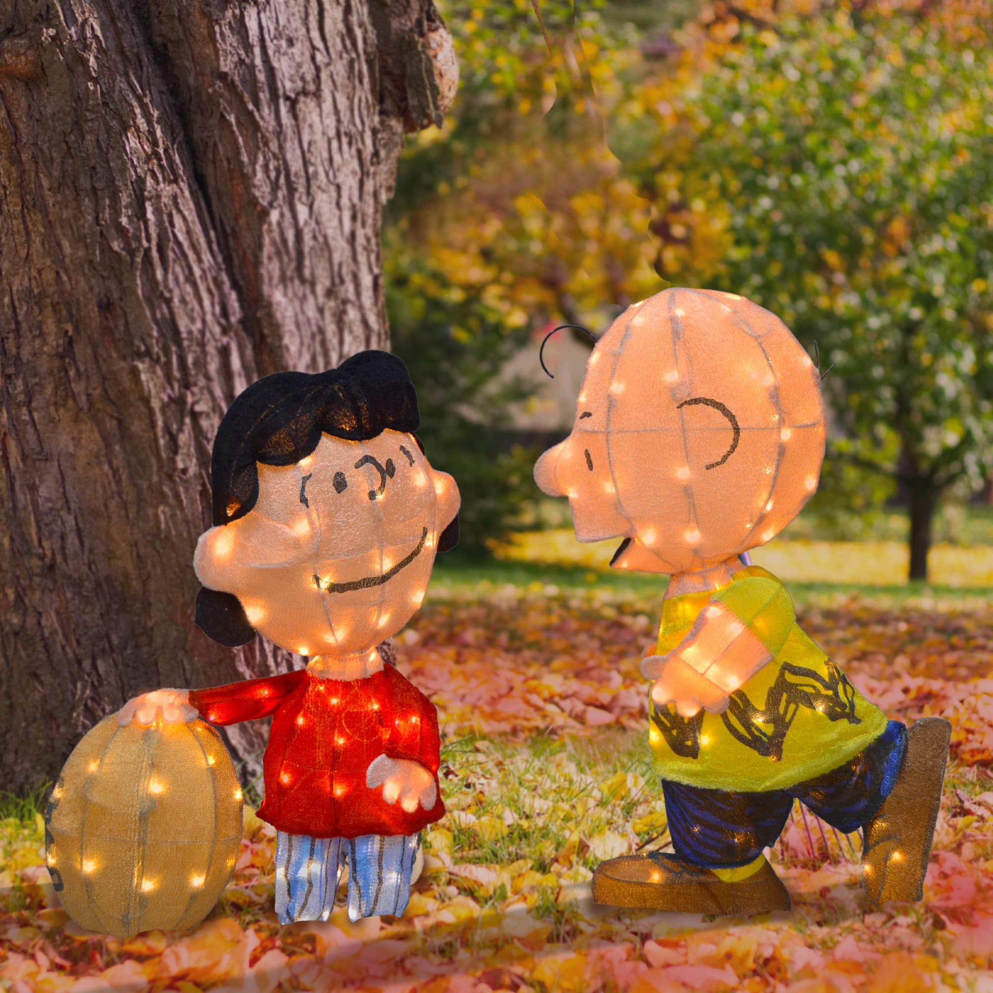 2.5ft. LED Peanuts Lucy with Football &#x26; Charlie Brown Yard Art