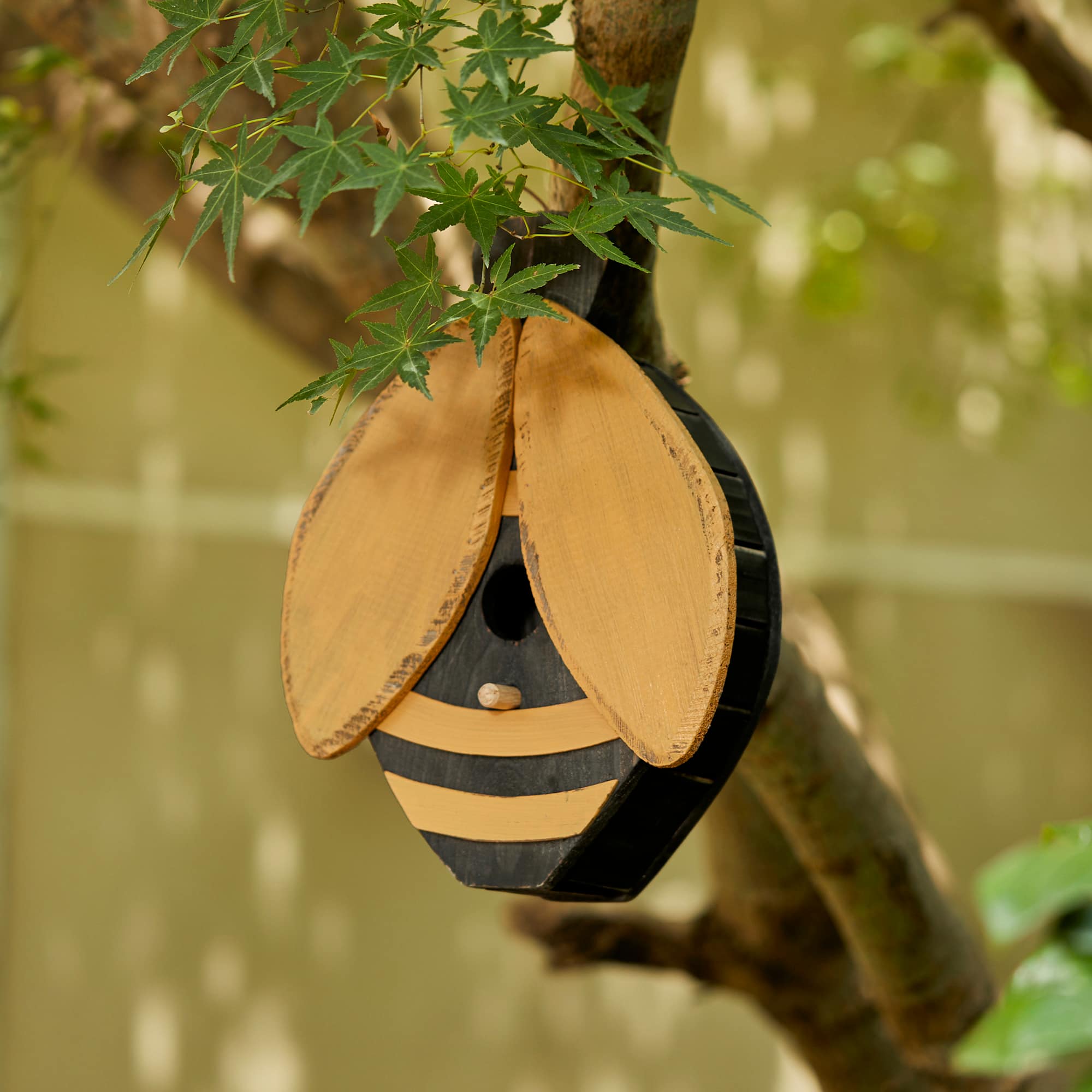 Glitzhome&#xAE; 11.75&#x22; Distressed Wood Bee-Shaped Birdhouse