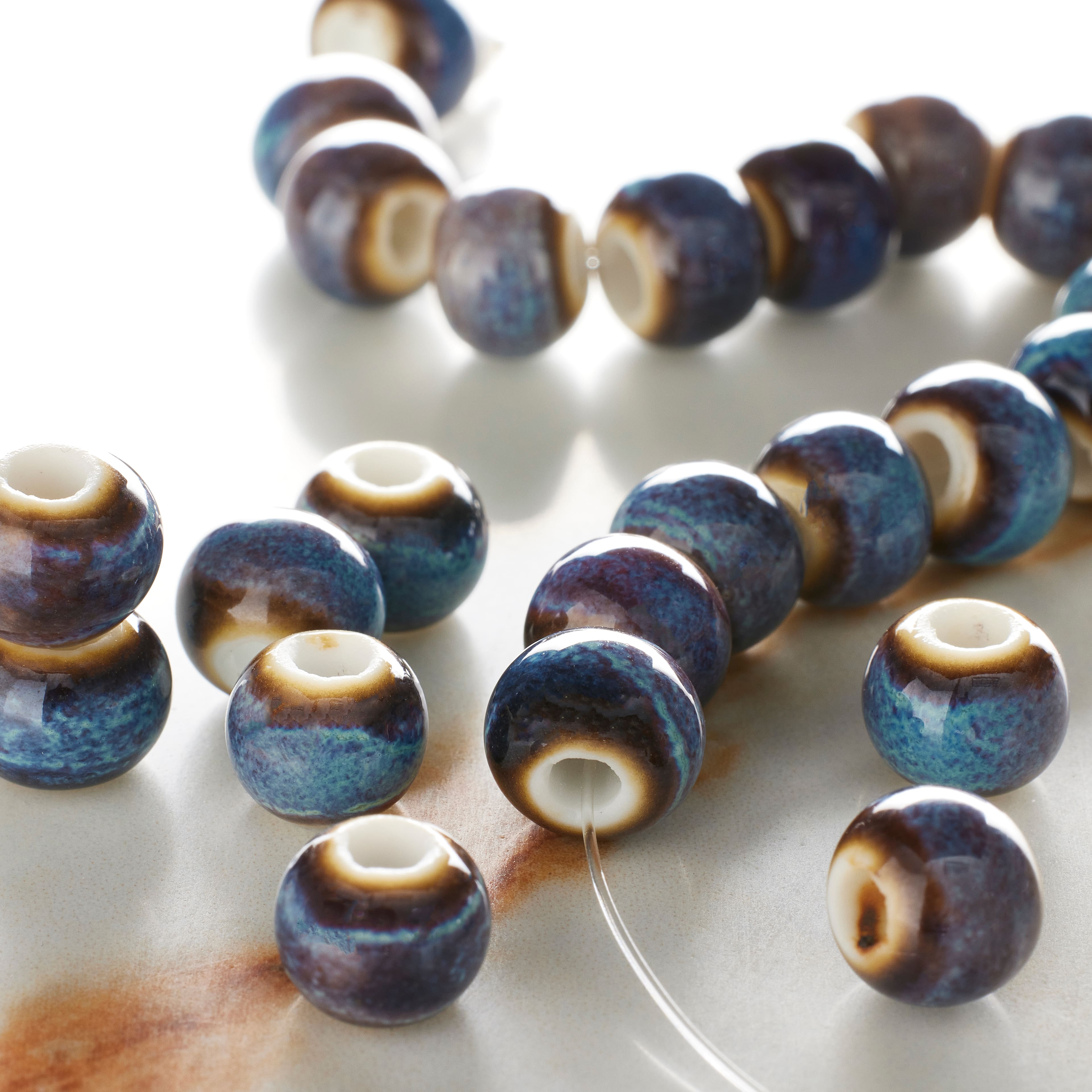 12 Pack: Blue & Brown Ceramic Round Beads, 8mm by Bead Landing™