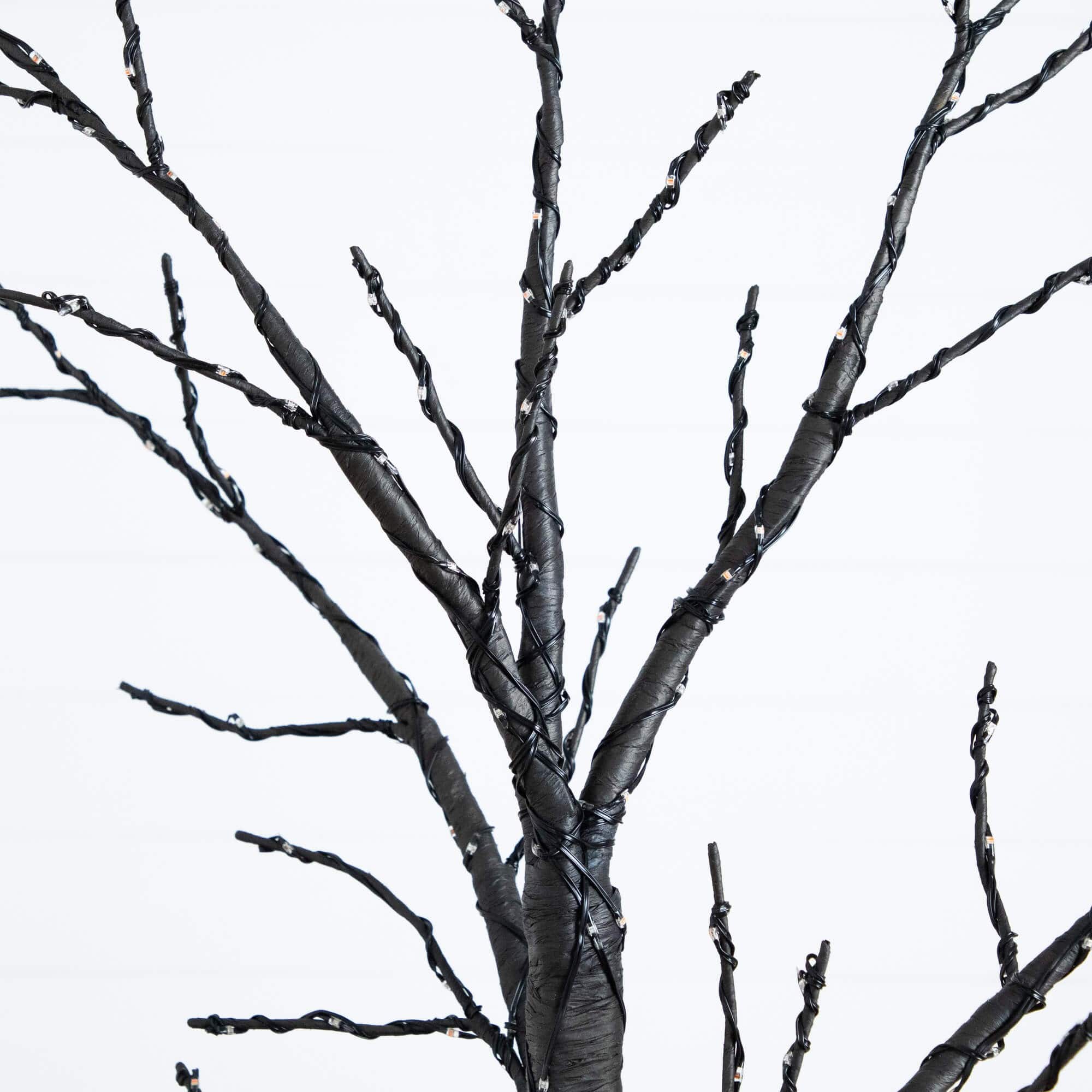 6ft. Pre-Lit Artificial Halloween Twig Tree with 480 Orange & Purple LED Lights