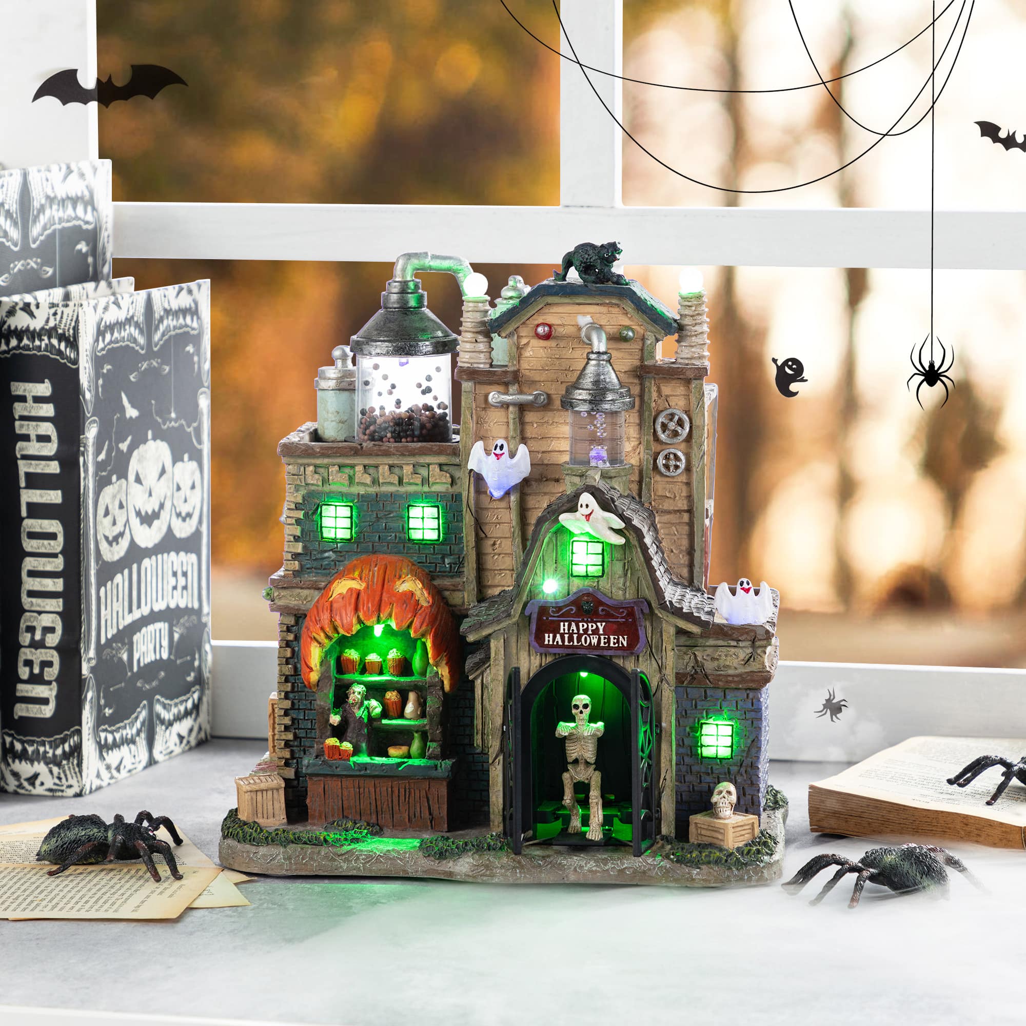 Glitzhome&#xAE; 11&#x22;H Lighted Resin Halloween Haunted House Village