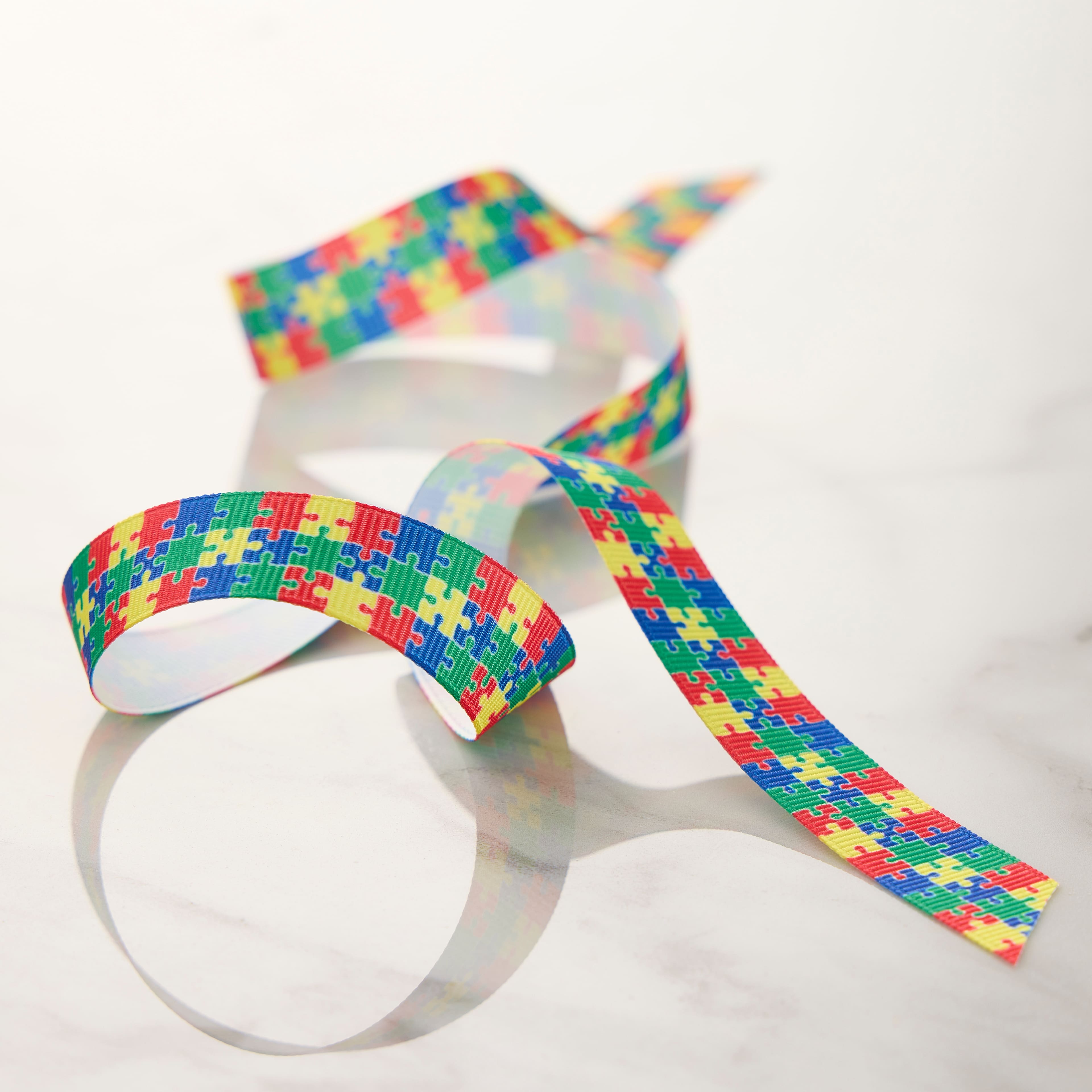 5/8&#x22; x 7yd. Multicolor Puzzle Pieces Grosgrain Ribbon by Celebrate It&#xAE; Classic