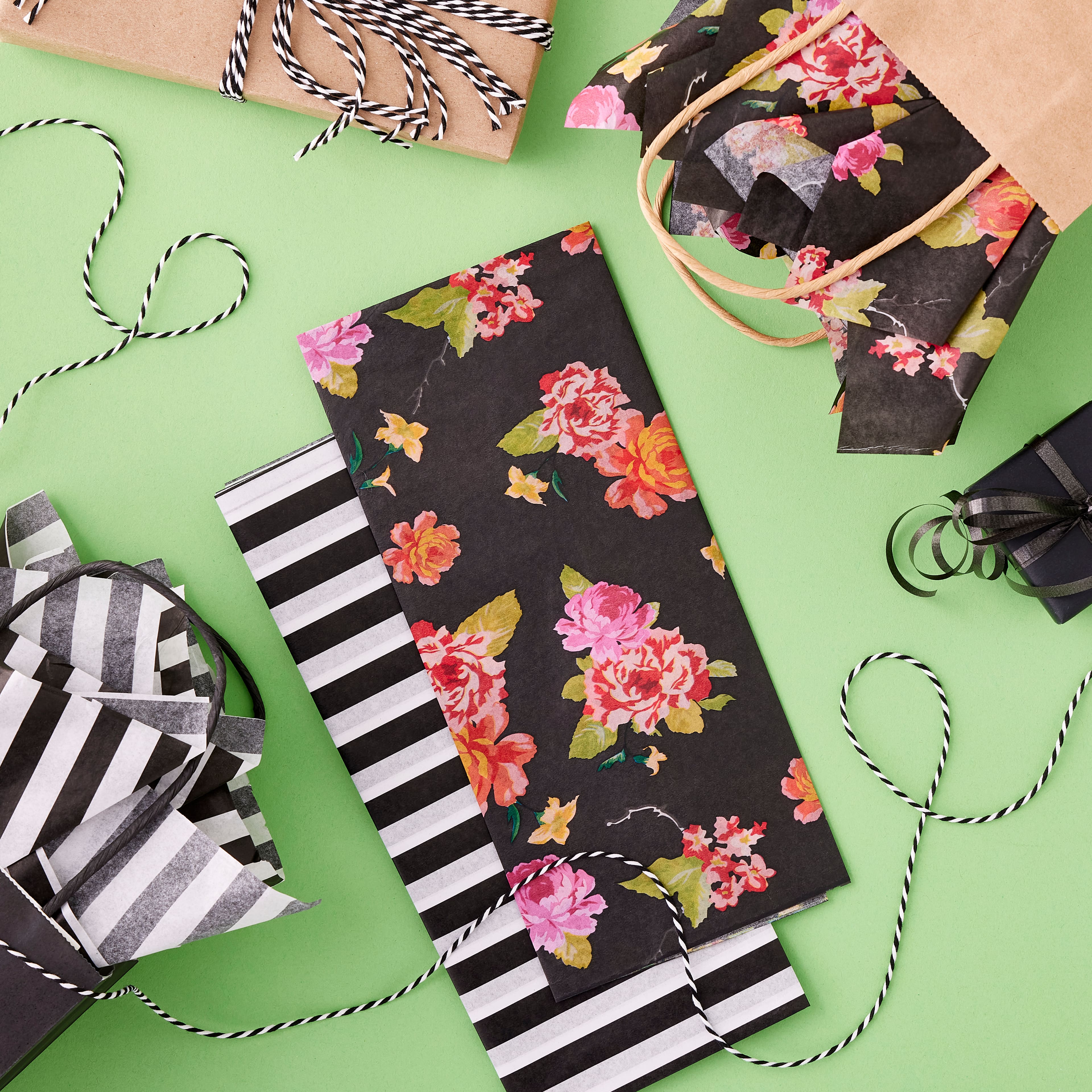 24 Packs: 10 ct. (240 total) Floral &#x26; Black Striped Tissue Paper by Celebrate It&#x2122;