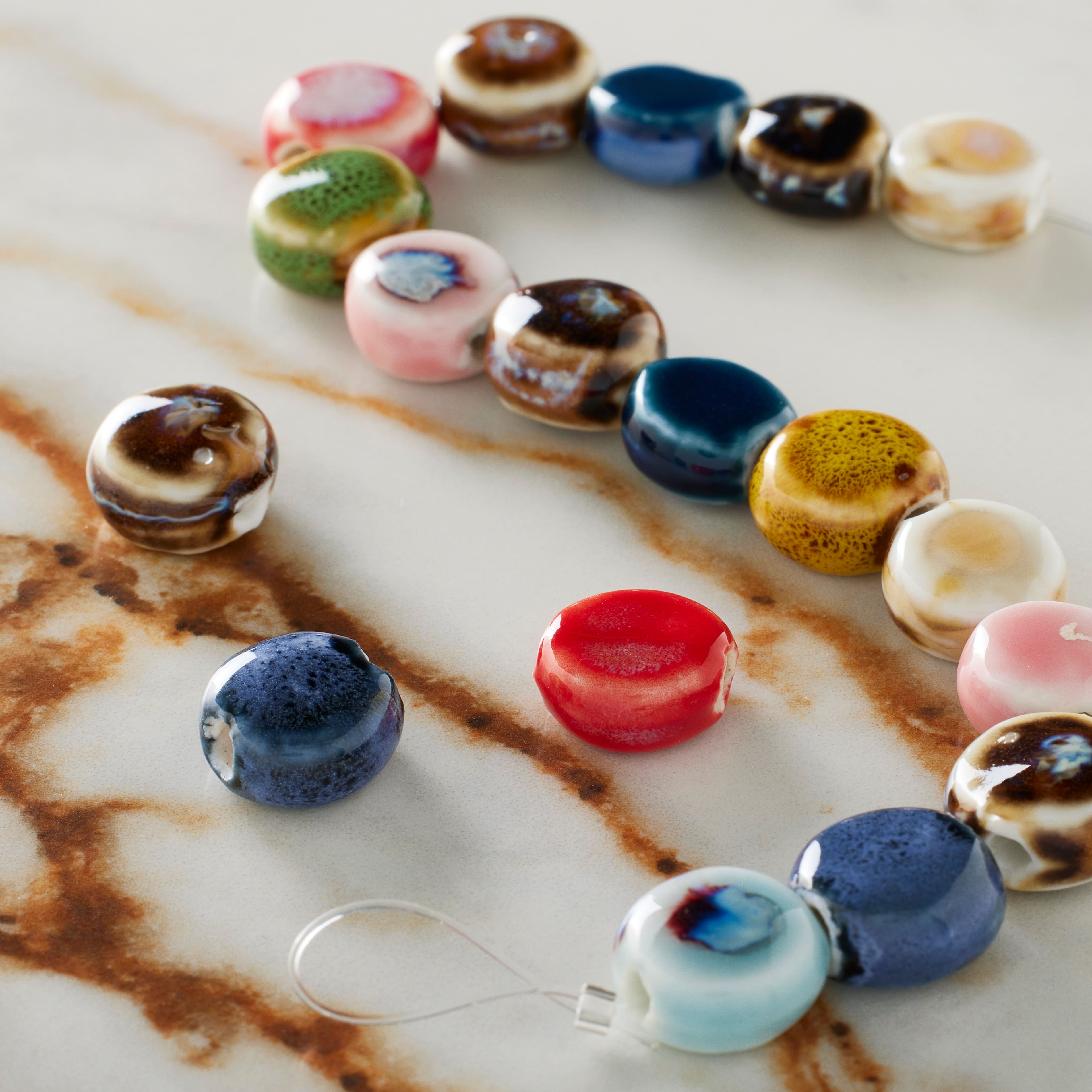 12 Packs: 18 ct. (216 total) Multicolor Ceramic Coin Beads, 10.5mm by Bead Landing™