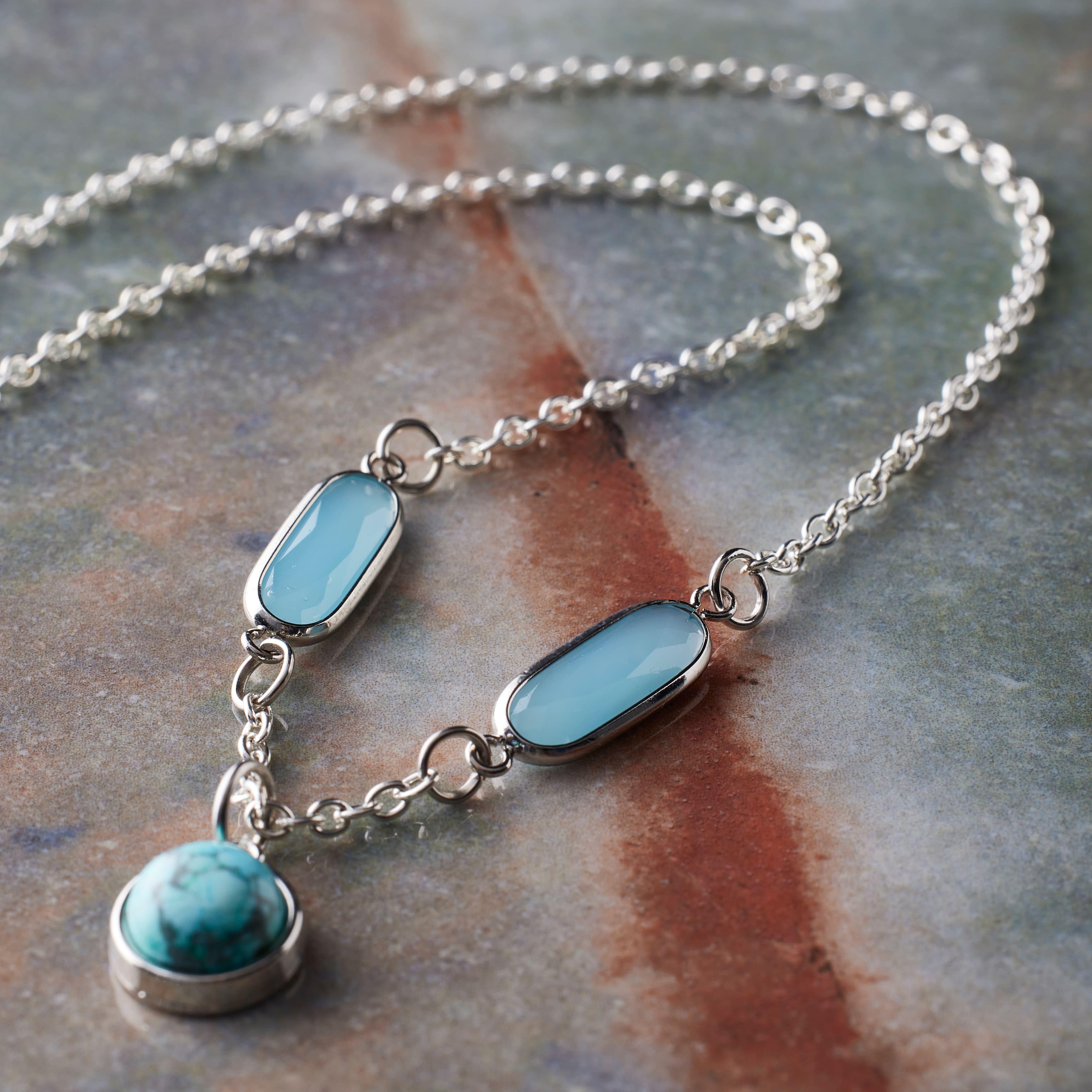 12 Packs: 2 ct. (24 total) Turquoise Glass Oval Connectors, 21mm by Bead Landing™