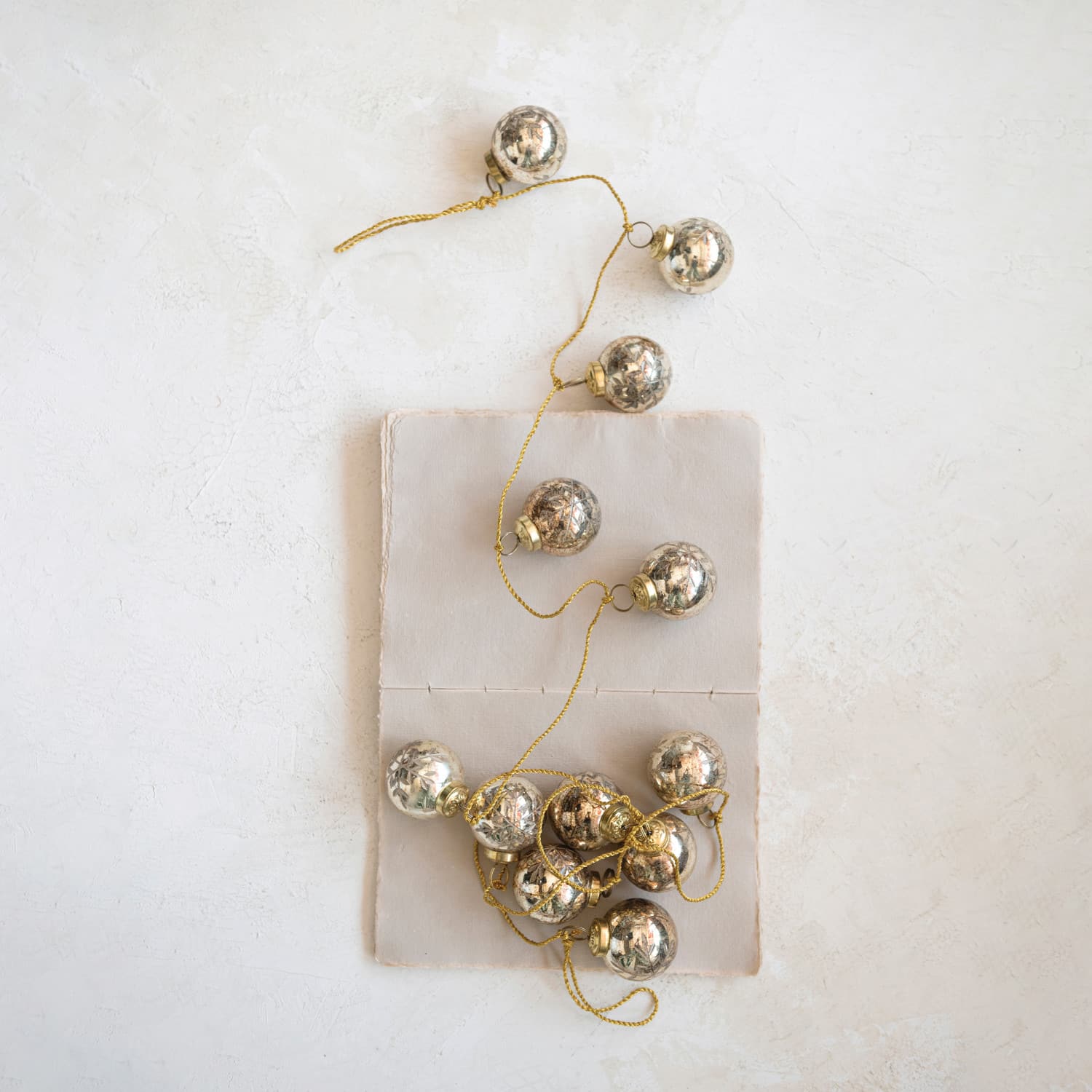 Hello Honey® 6ft. Antique Gold Etched Mercury Glass Ball Ornament Garland with Snowflakes