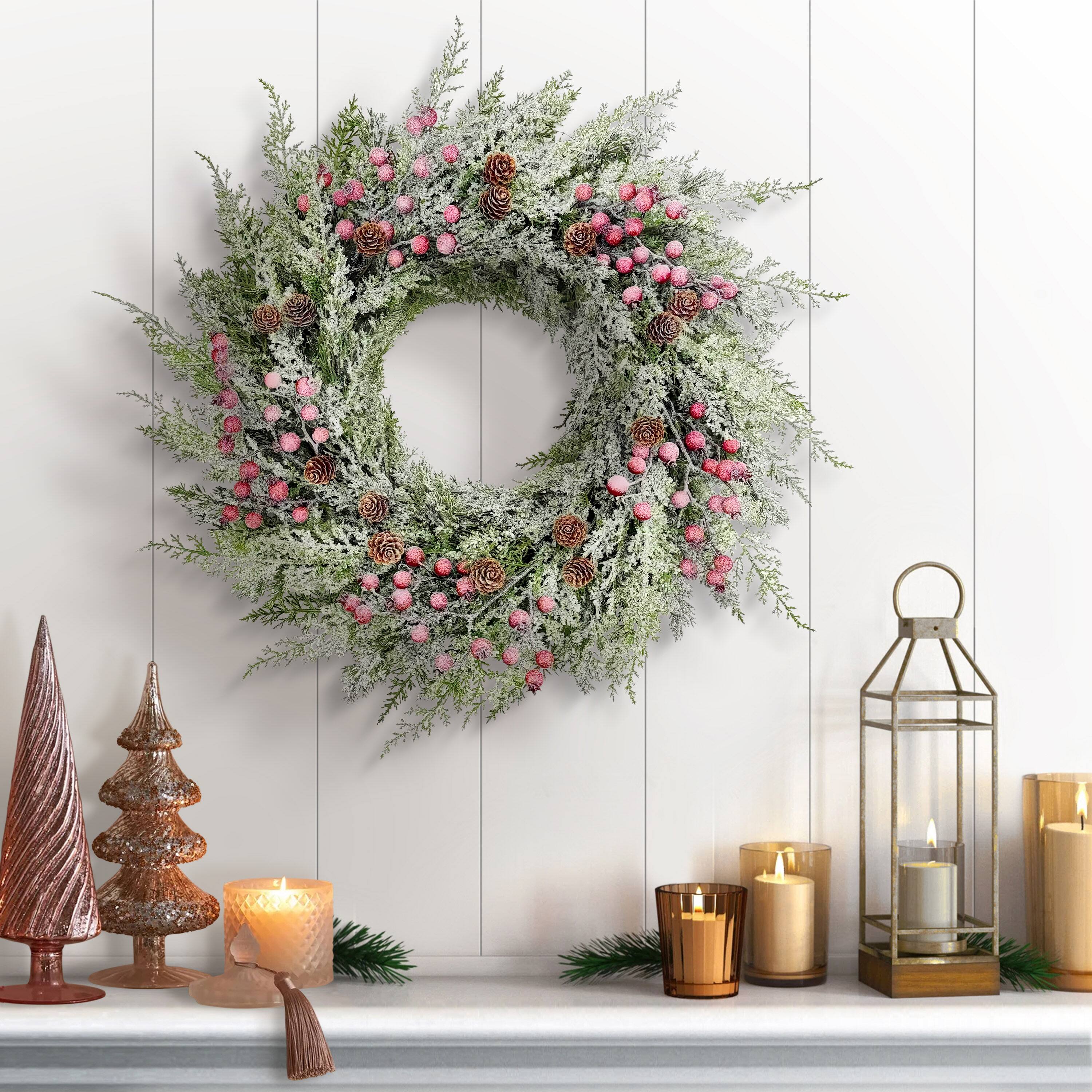 24" Flocked Green Adorned Artificial Wreath with Pinecones & Red Berries