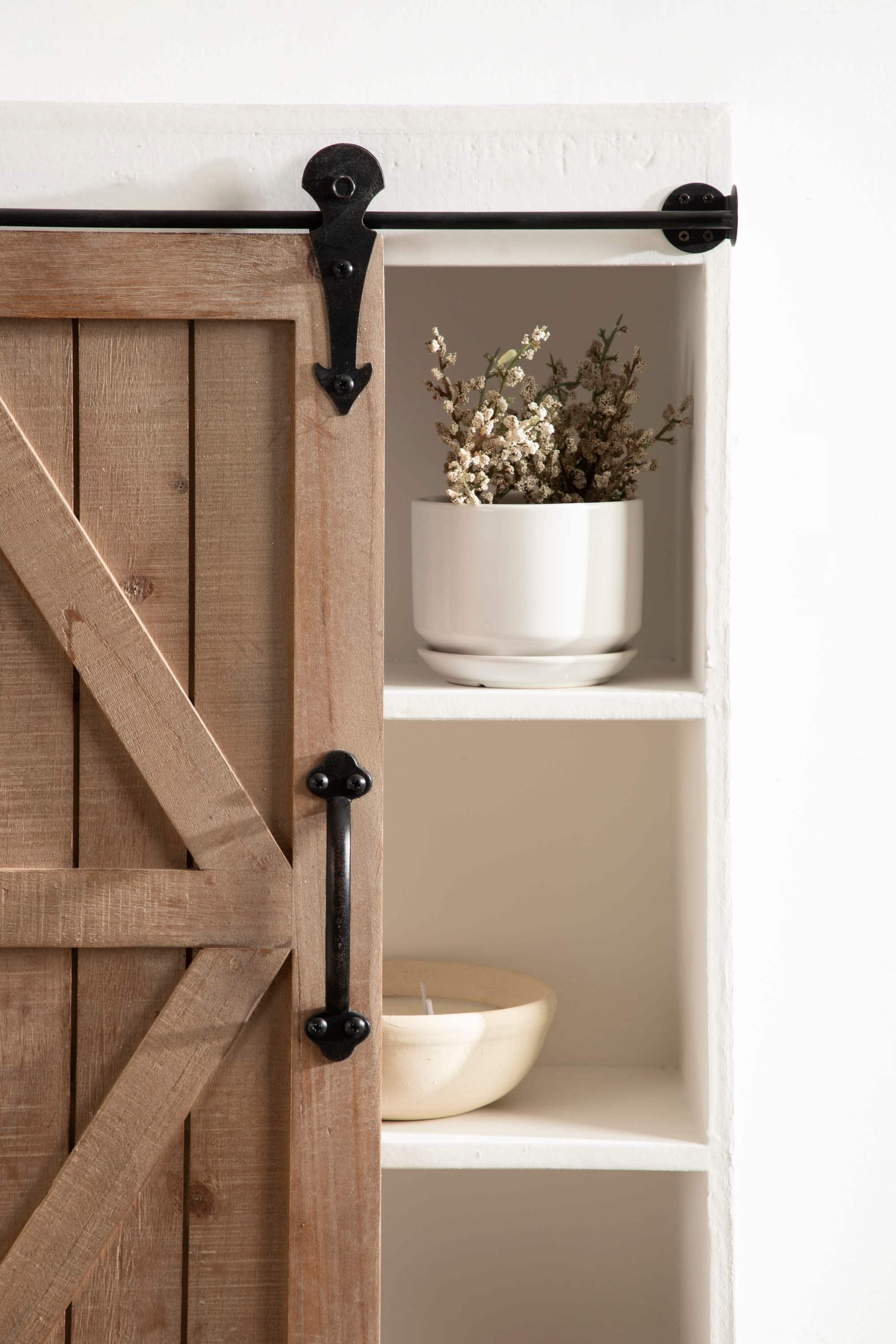 Kate and Laurel Cates Wood Wall Storage Cabinet with Sliding Barn Door