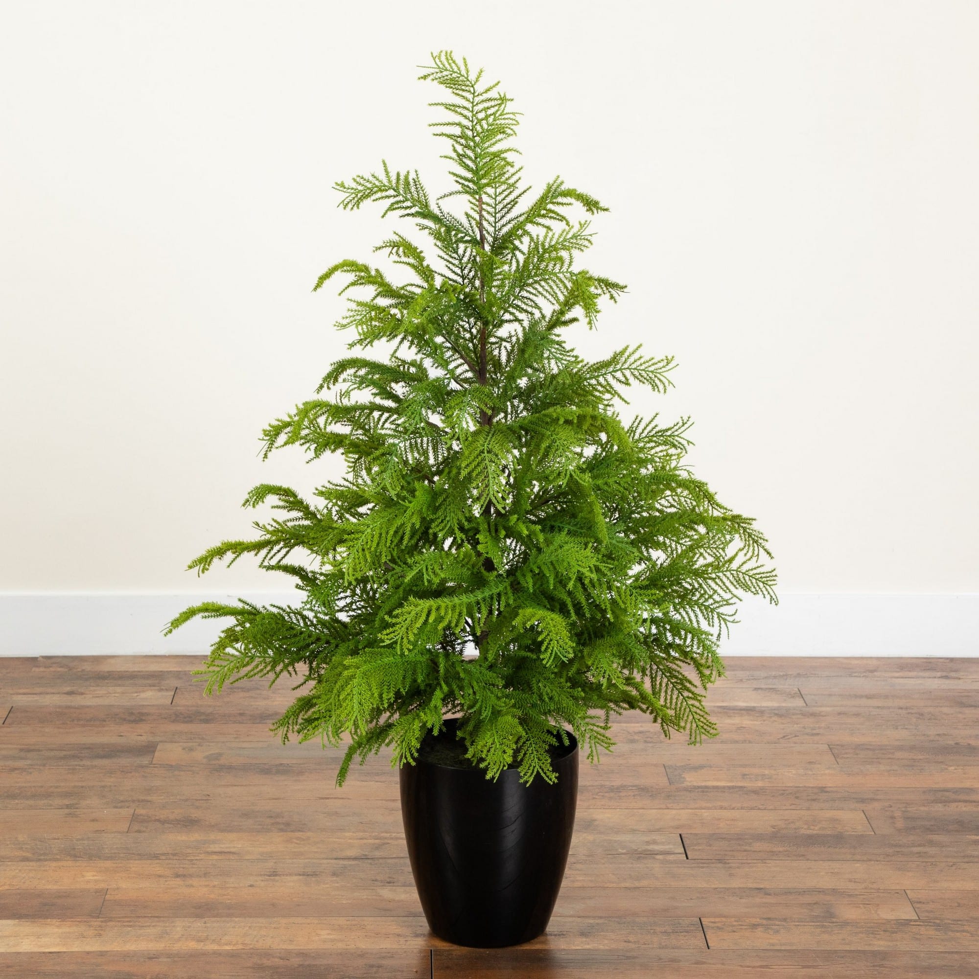 Nearly Natural 4ft. Unlit Artificial Real Touch Goldcrest Christmas Tree in Black Decorative Planter