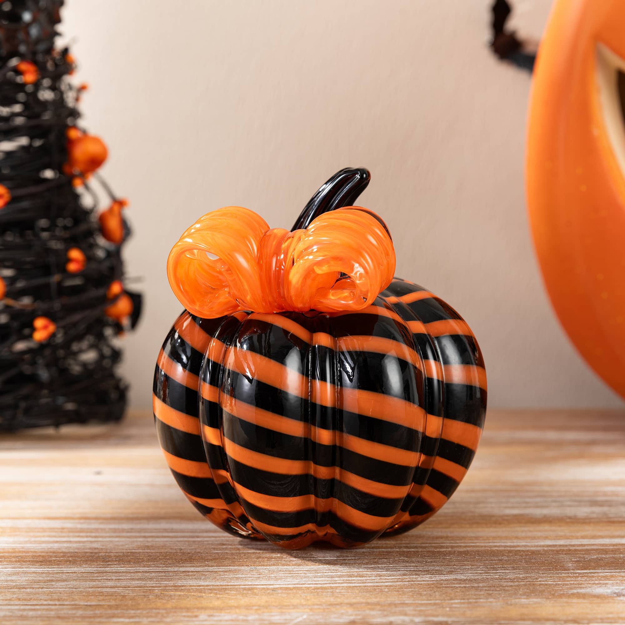 Glitzhome® 4.75" Halloween Striped Glass Pumpkin with Bow