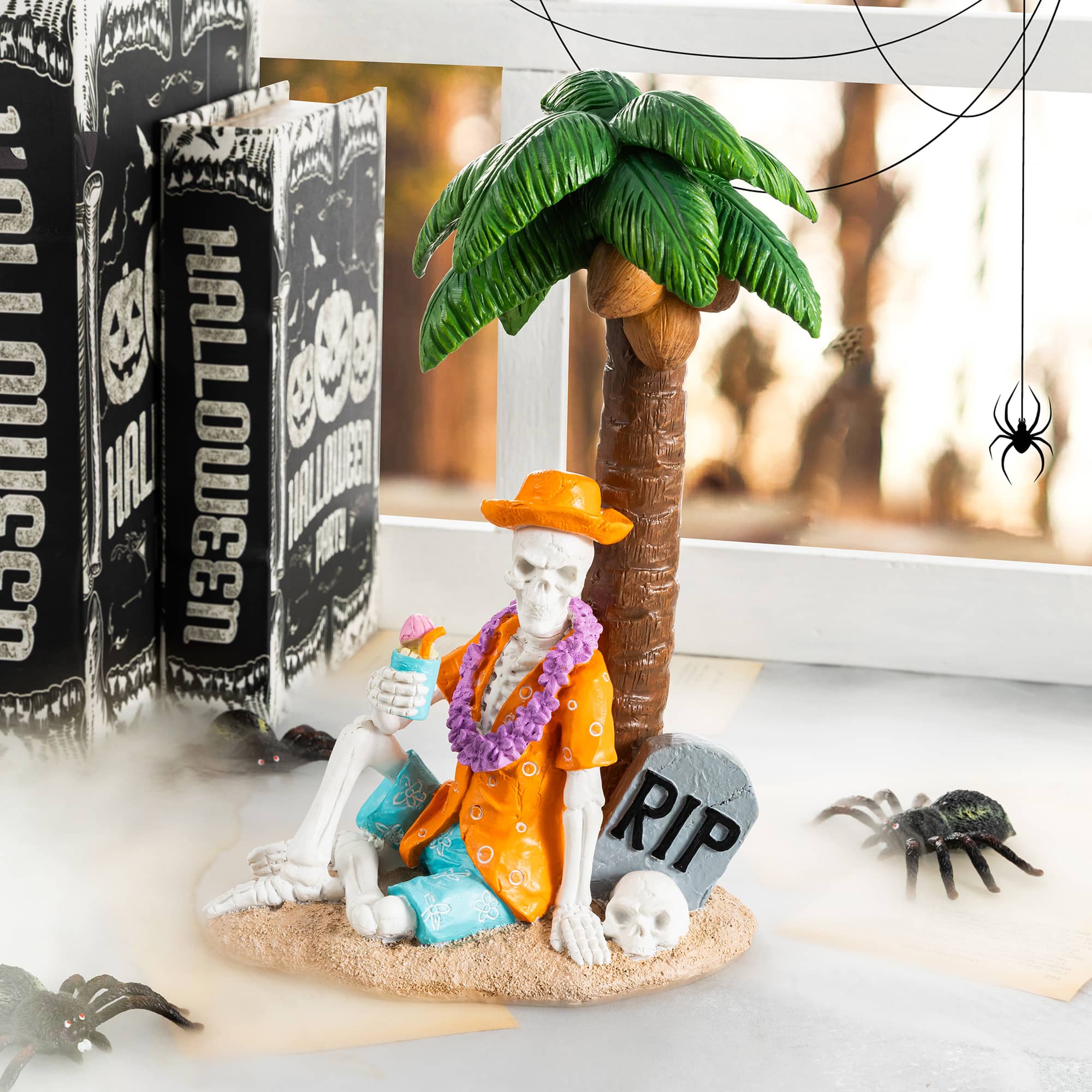 Glitzhome® 11.5" Halloween Polyresin Skeleton on Beach Table Decor