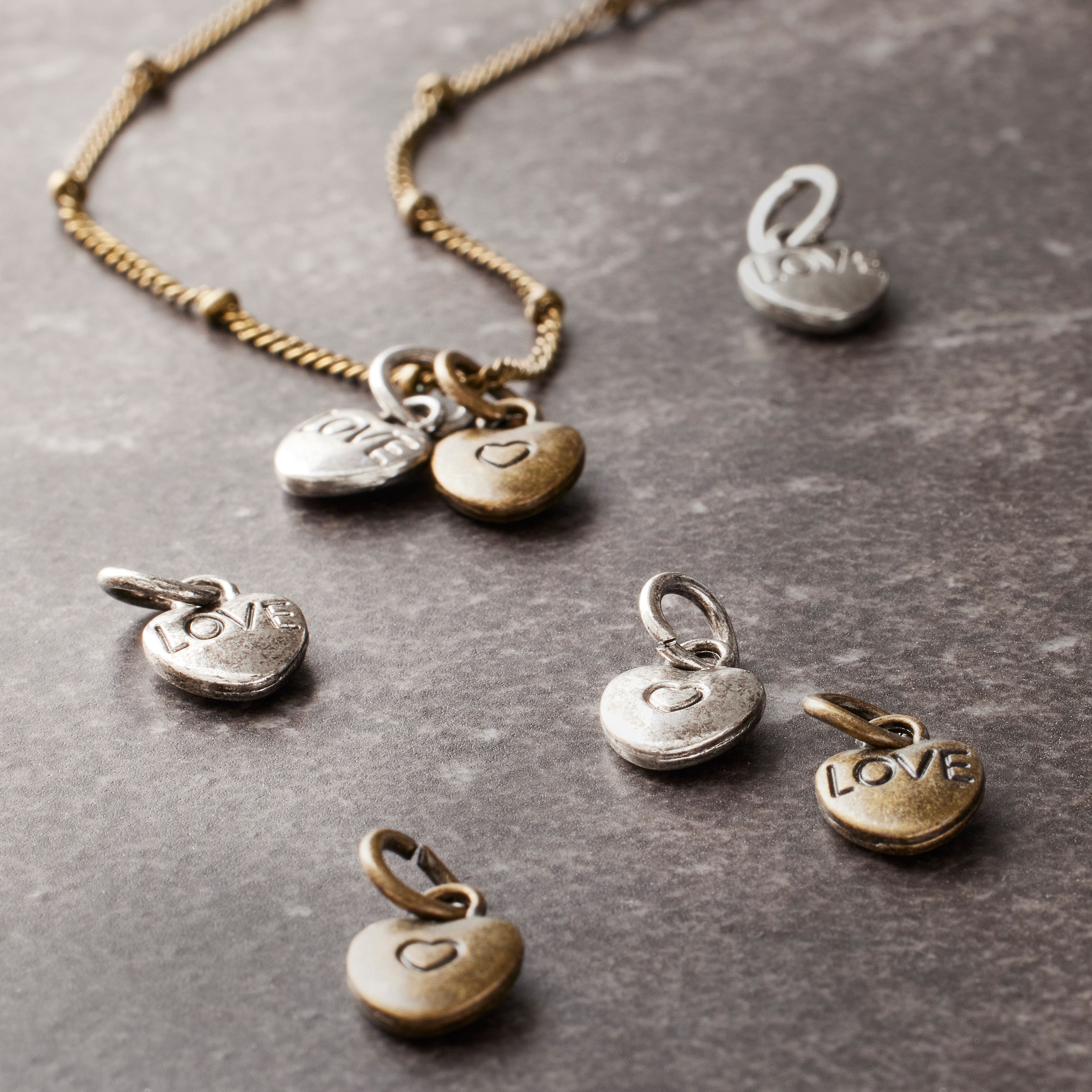 12 Packs: 25 ct. (300 total) Metal Heart-Shaped Charms by Bead Landing™