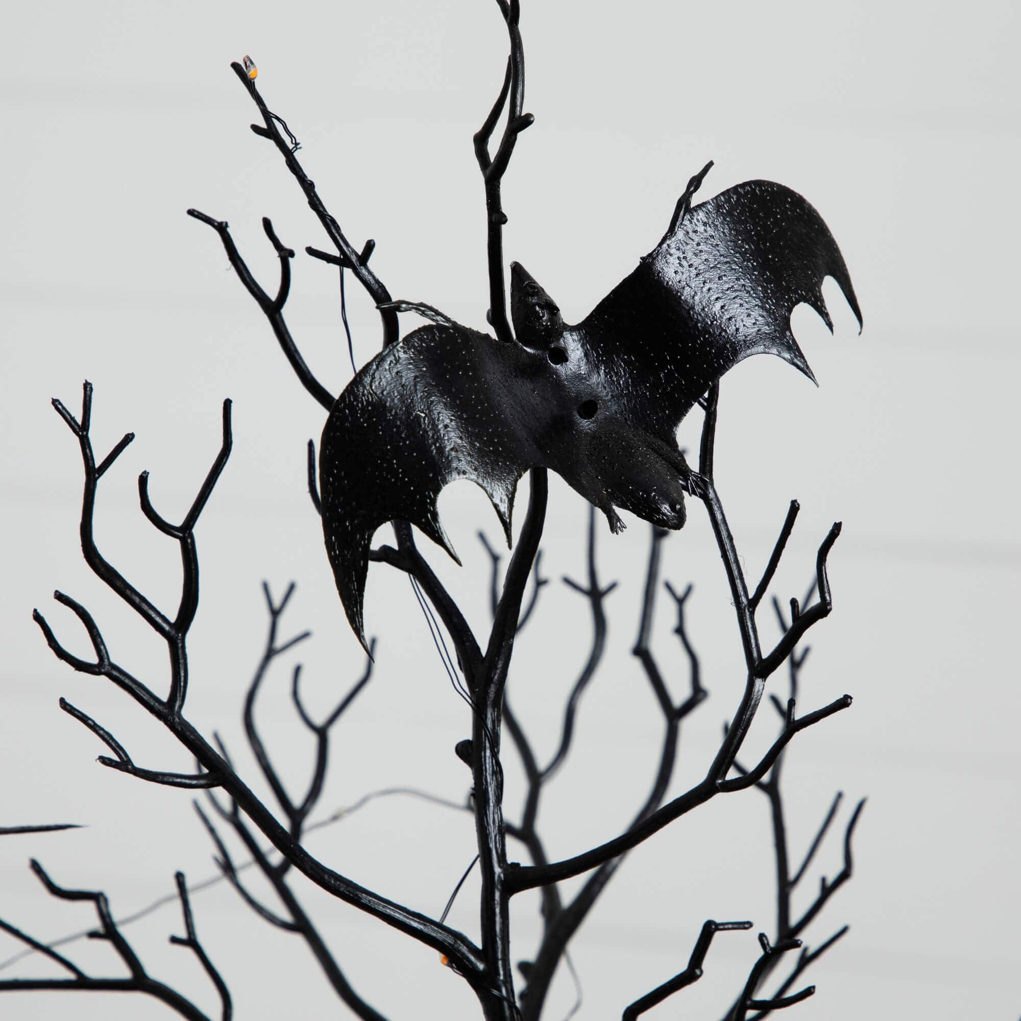 2ft. Pre-Lit Artificial Halloween Black Spooky Twig Tree with Bats and 40 Orange & Purple LED Lights