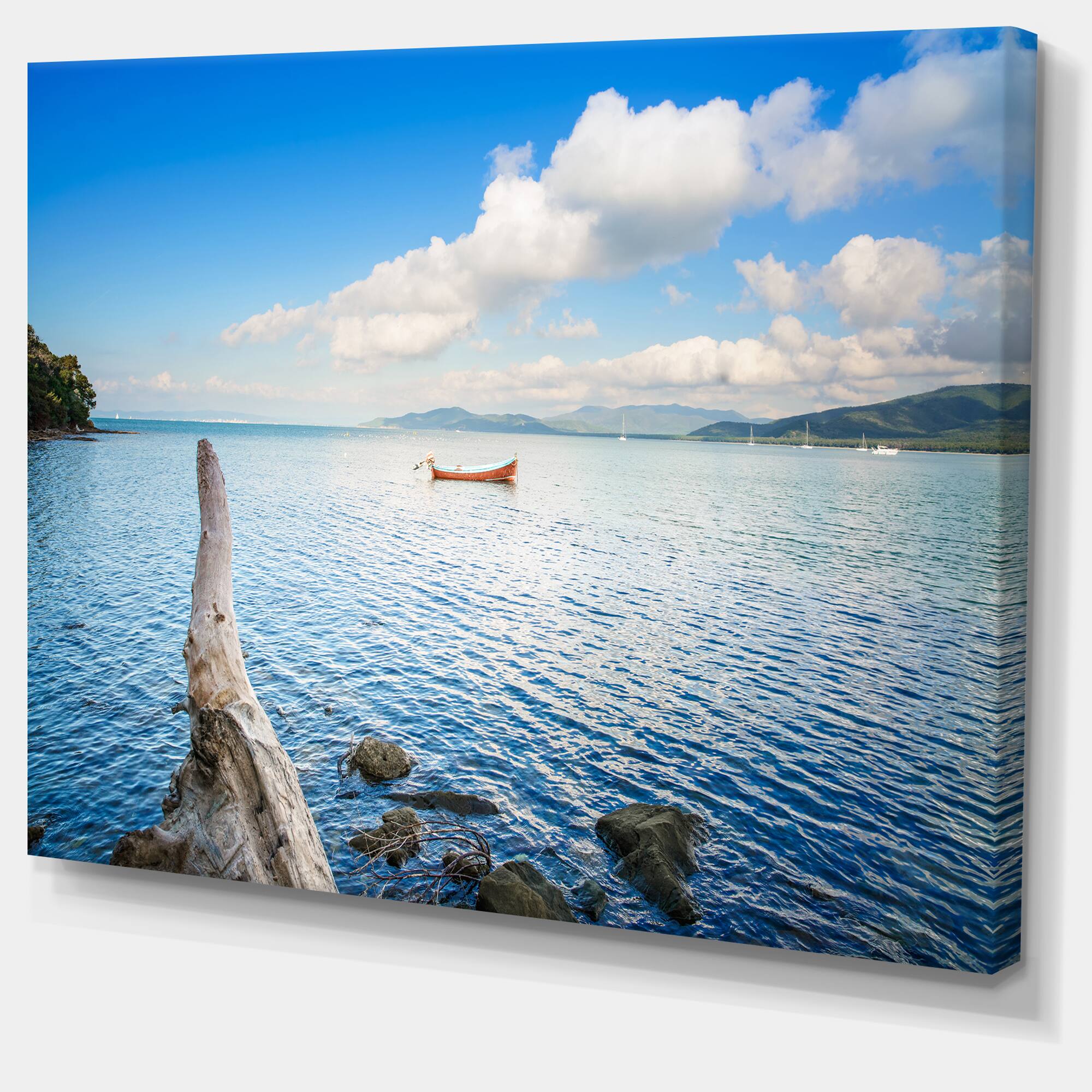 Designart - Small Wooden Boat and Tree Trunk