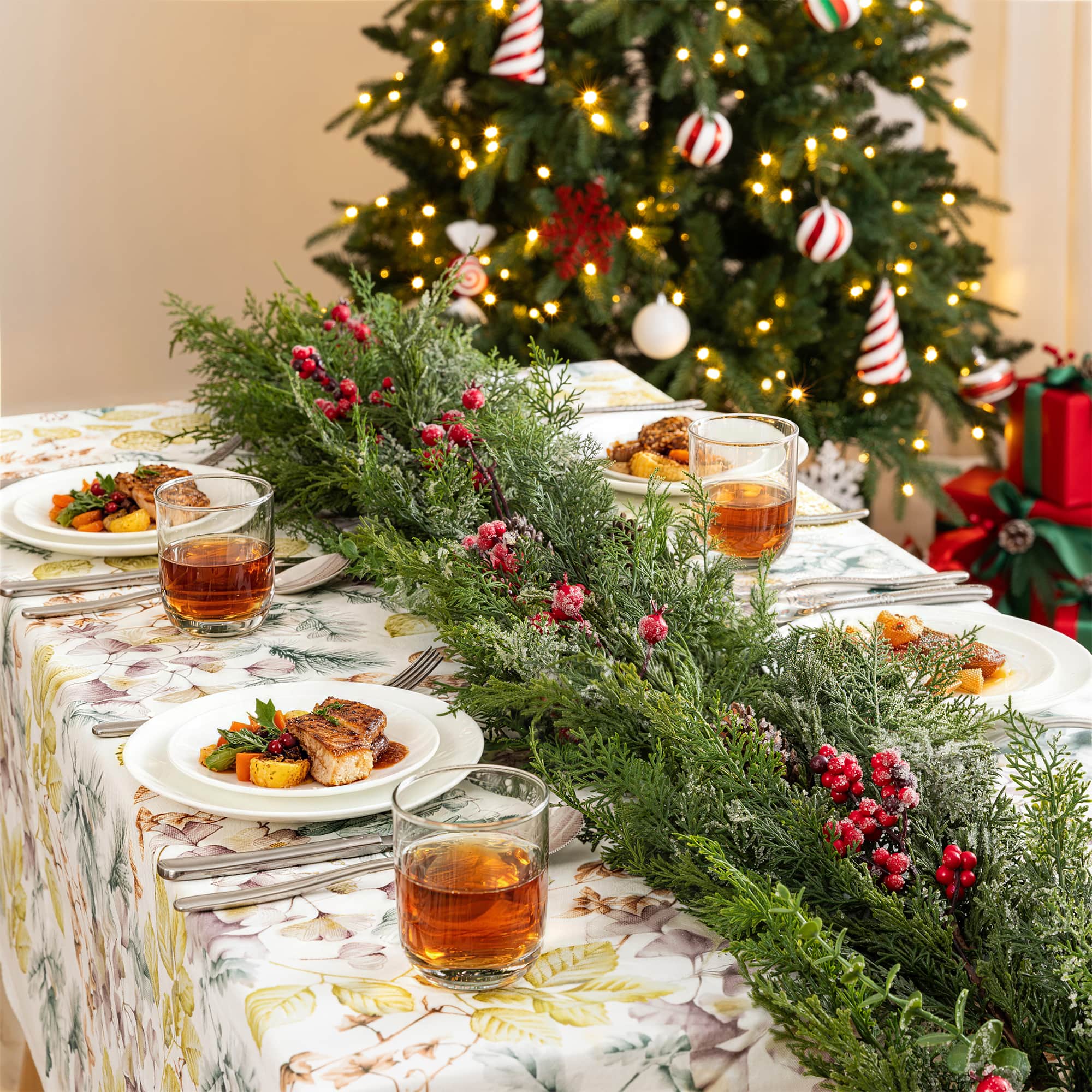 Glitzhome® 9ft. Christmas Greenery Frosted PE Dripping Garland with Pinecones & Red Berries