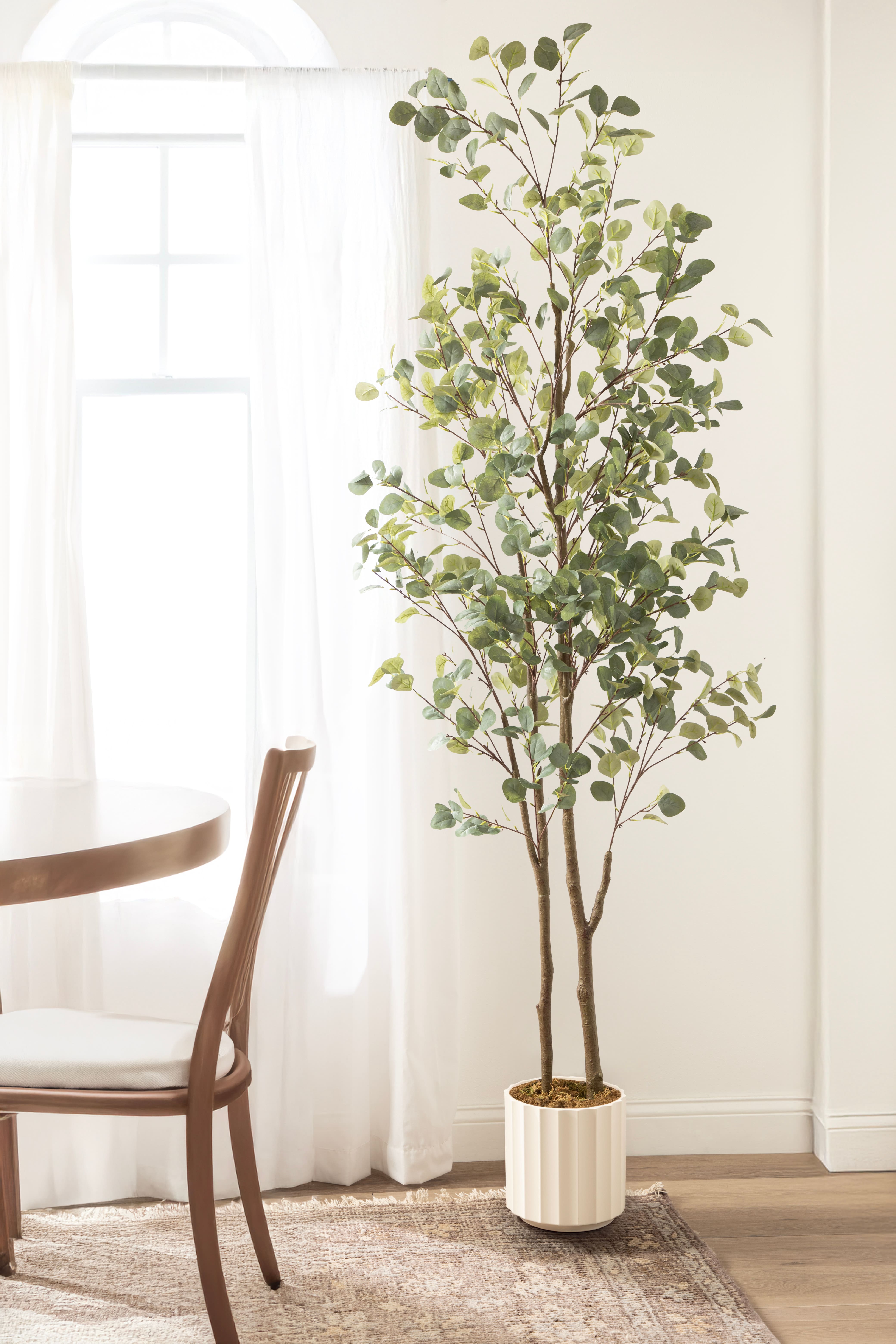 Kate and Laurel 8ft. Green Eudora Faux Eucalyptus Tree in White Planter