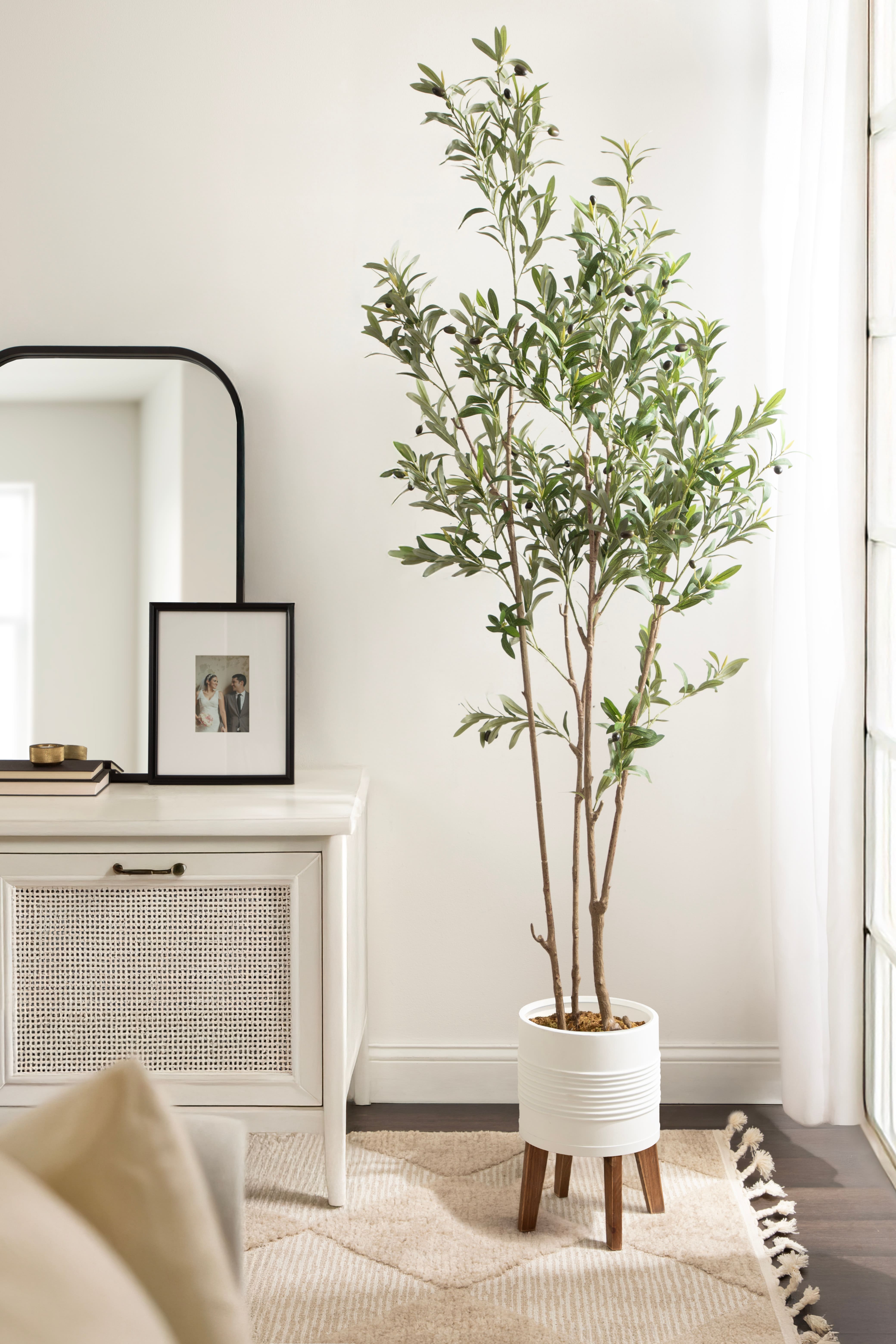 Kate and Laurel 7ft. Oliveira Faux Olive Tree in Rustic Brown Footed Planter
