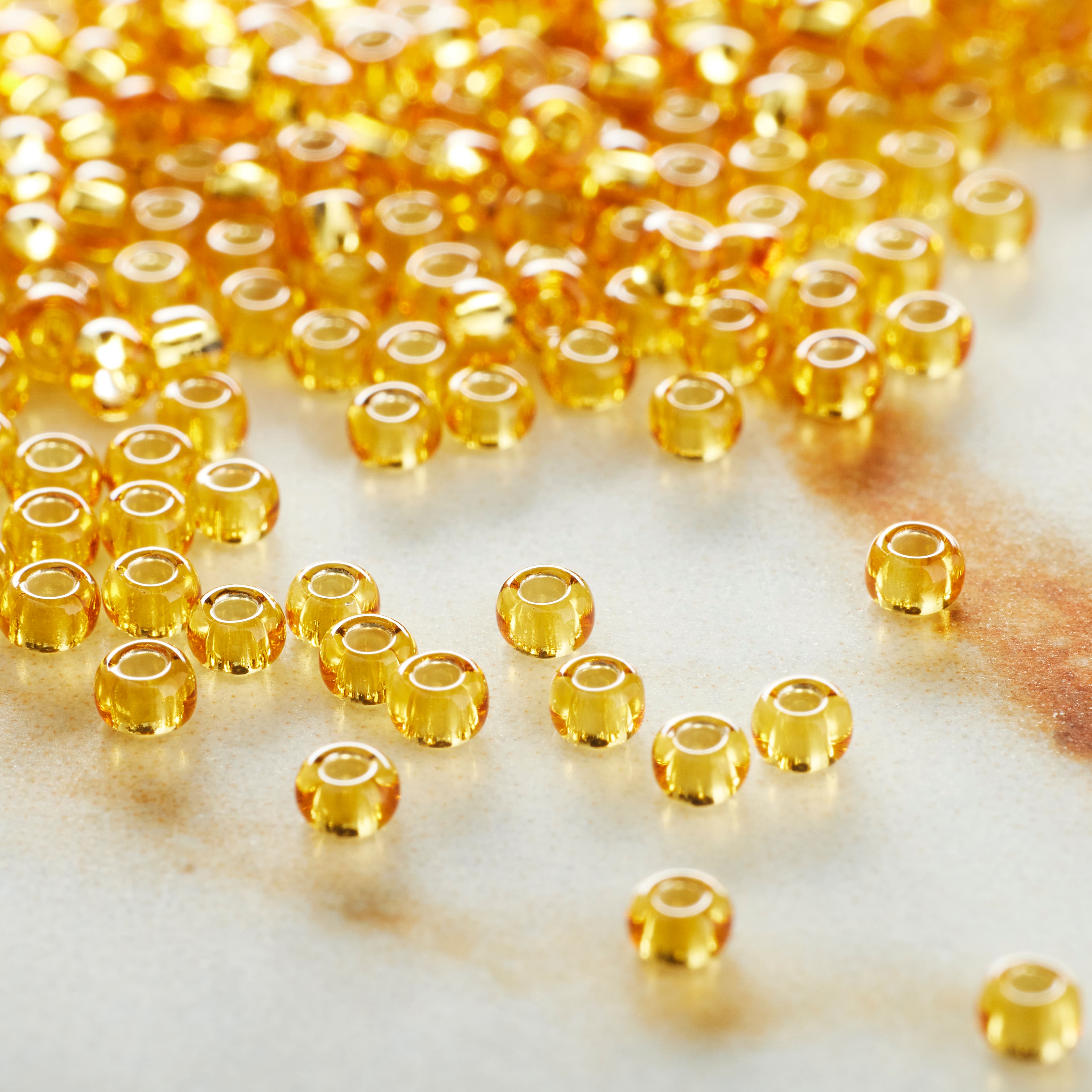 12 Pack: John Bead Transparent Czech Glass Seed Beads, 11/0
