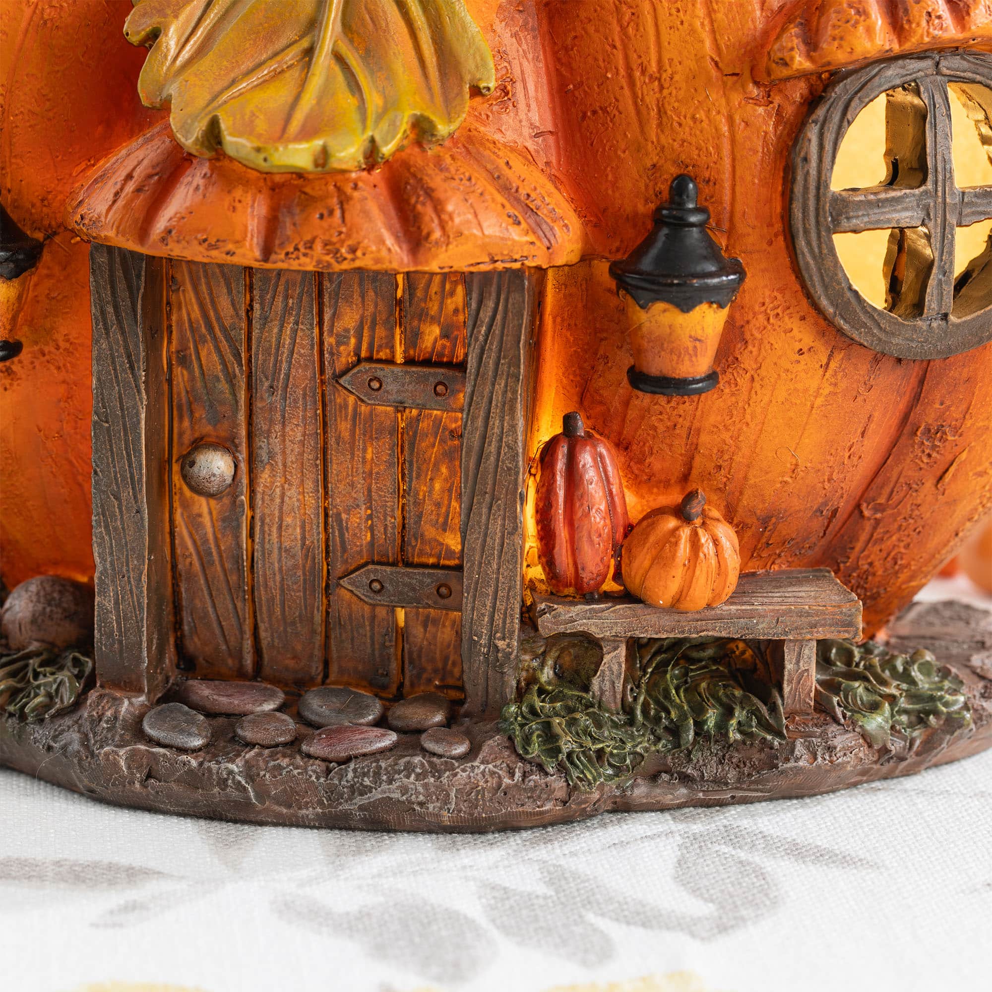 Glitzhome® 8.5" Lighted Fall Resin Pumpkin House Table Decor with Timer