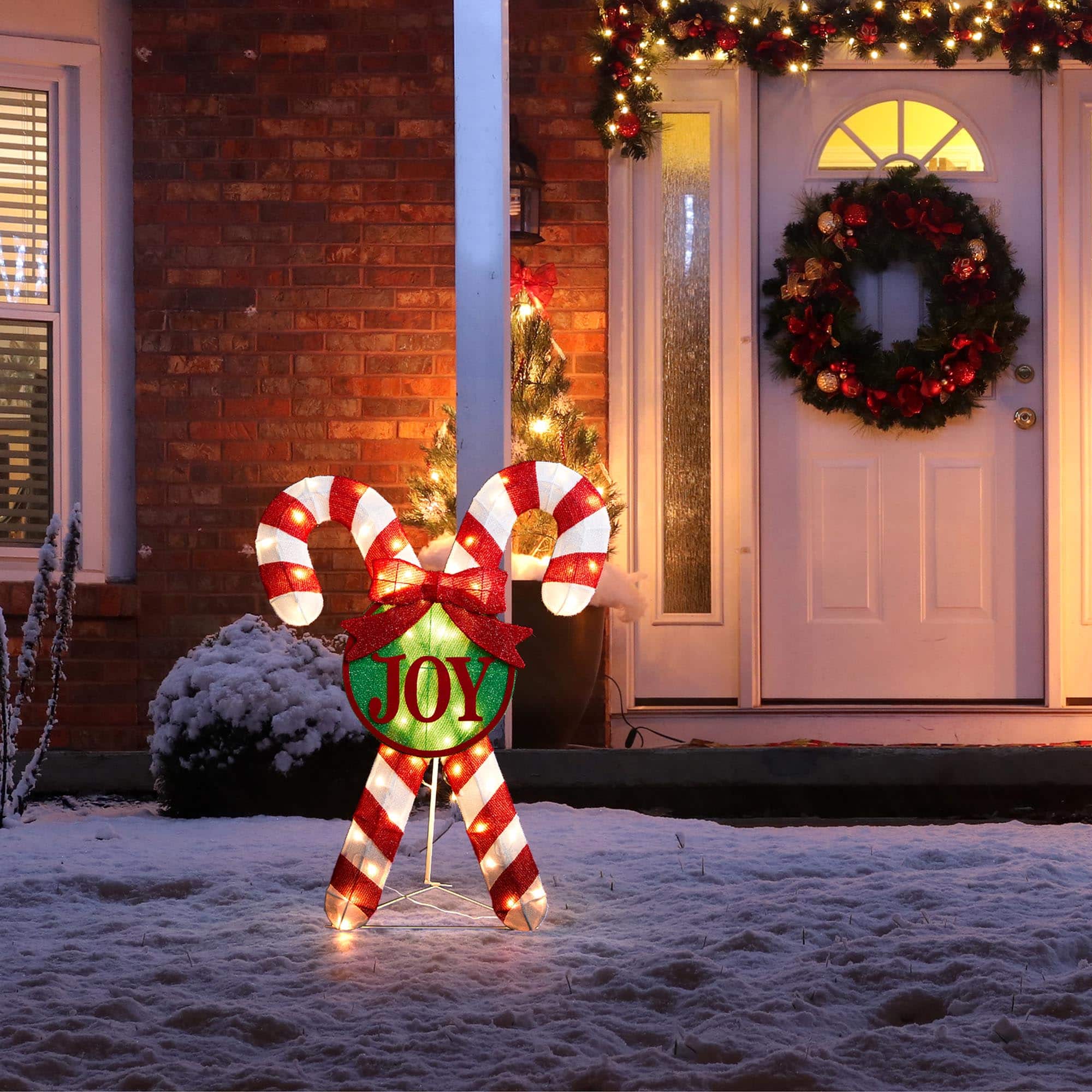Glitzhome® 3ft. Lighted Christmas Candy Cane Outdoor Décor