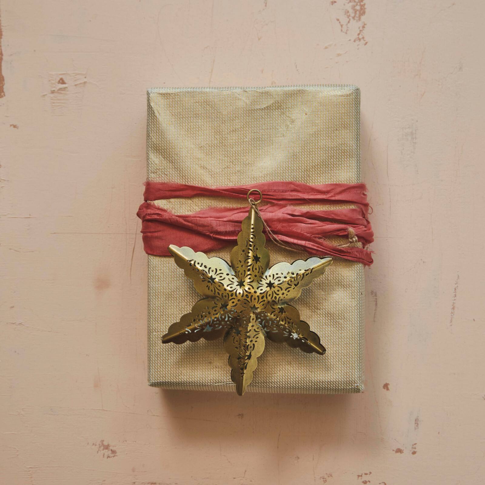 Hello Honey® 12 Pack 5.75" Antique Brass Electroplated Metal Laser Cut Star Ornaments