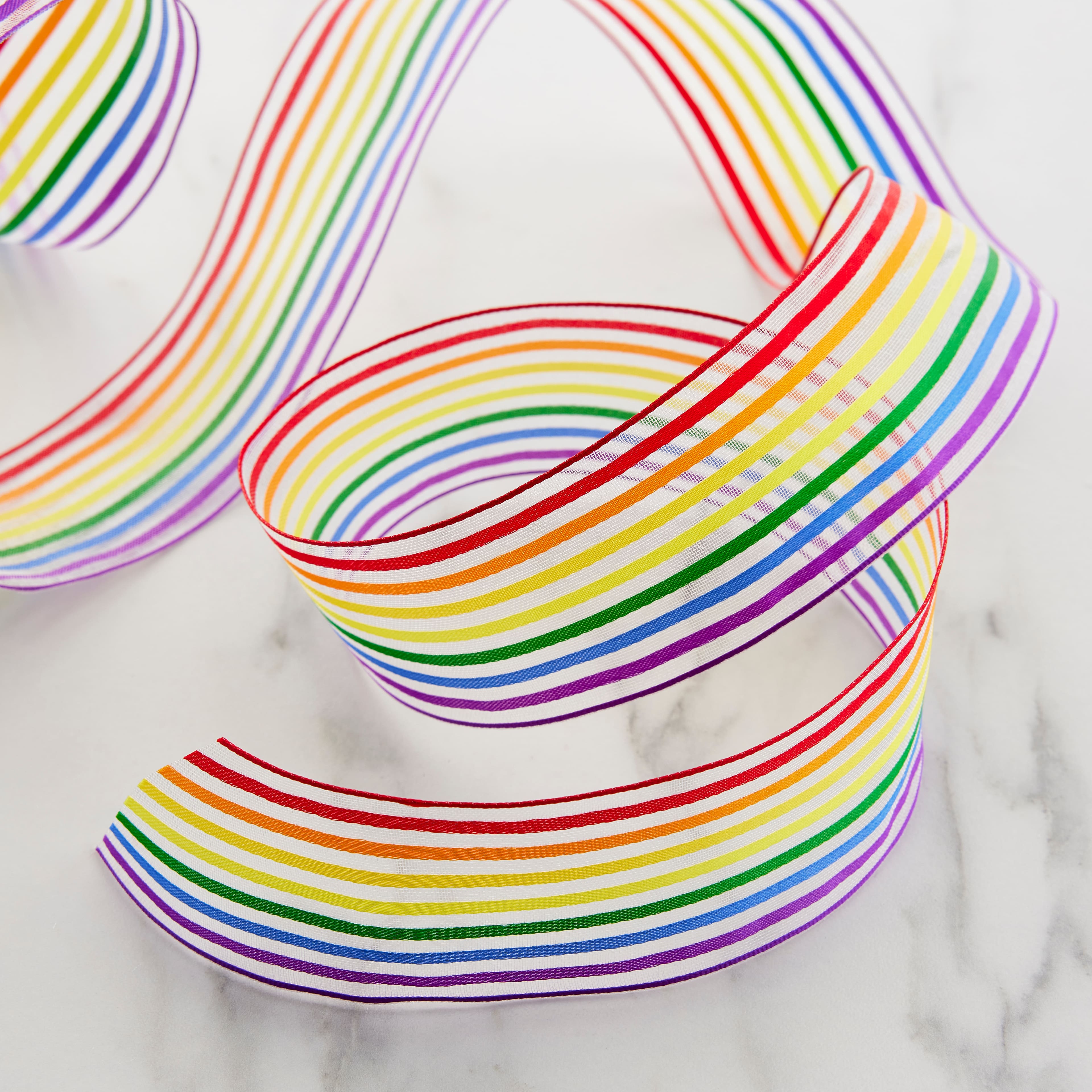 12 Pack: 1.5" x 3yd. Sheer Wired Rainbow Striped Ribbon by Celebrate It™ 360°™