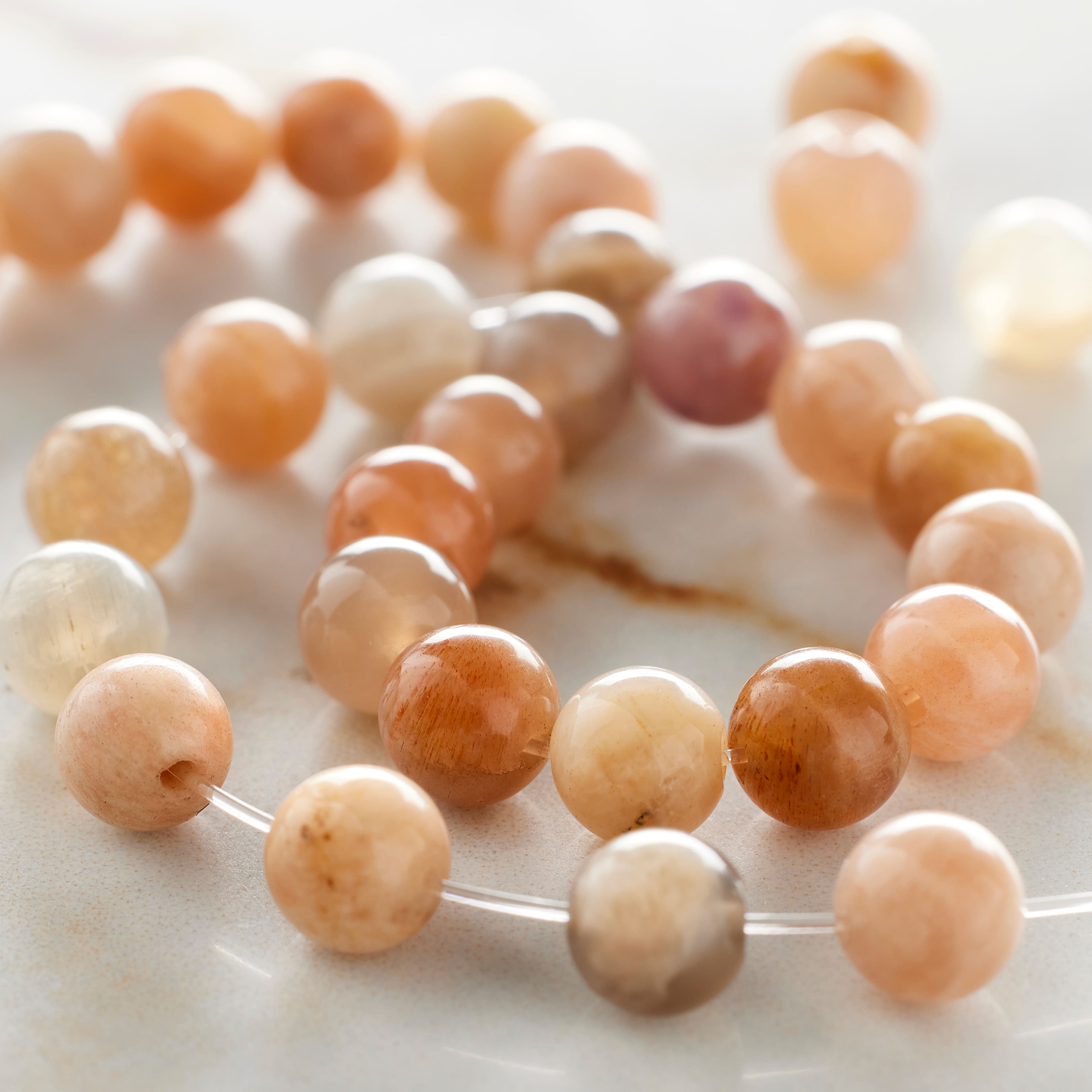 12 Pack: Light Pink & Orange Sunstone Round Beads, 6mm by Bead Landing™