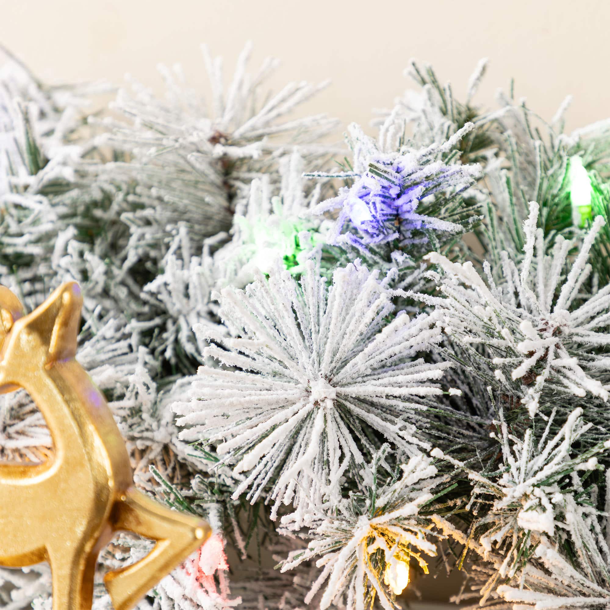 Glitzhome® 9ft Pre-Lit Snow Flocked Greenery Pine Christmas Garland with Timer