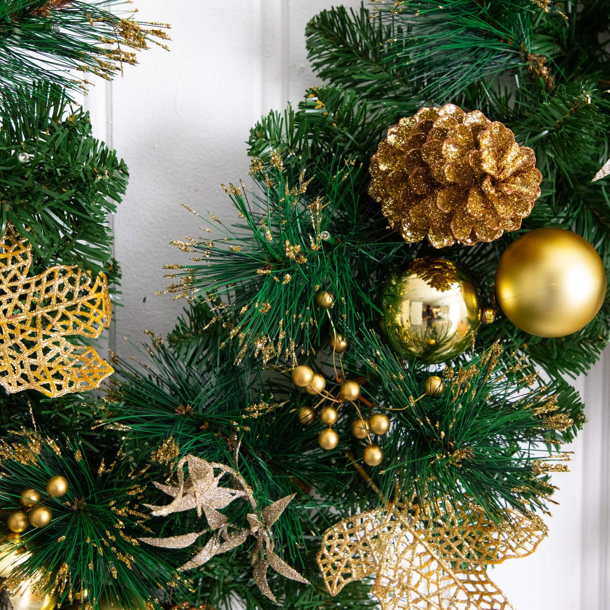 9ft. Pre-Lit Artificial Golden Frosted Christmas Garland with 50 Warm White LED Lights Pinecones, Berries and Ornaments