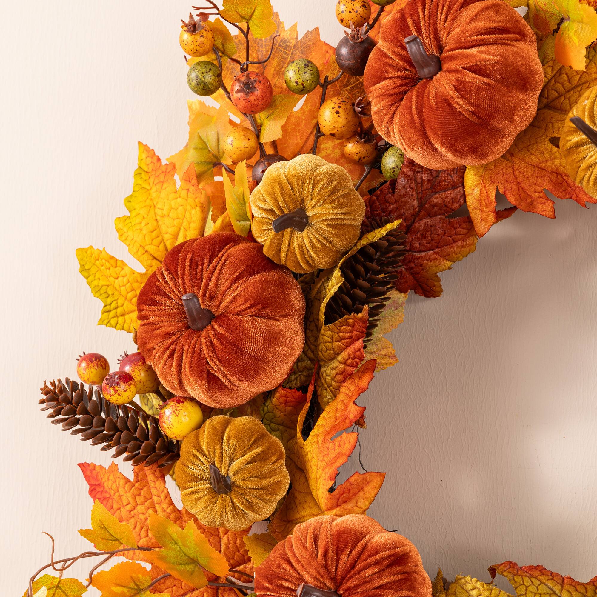 Glitzhome® 24" Fall Velvet Pumpkin, Pinecone & Berry Wreath with Black Metal Wreath Hanger