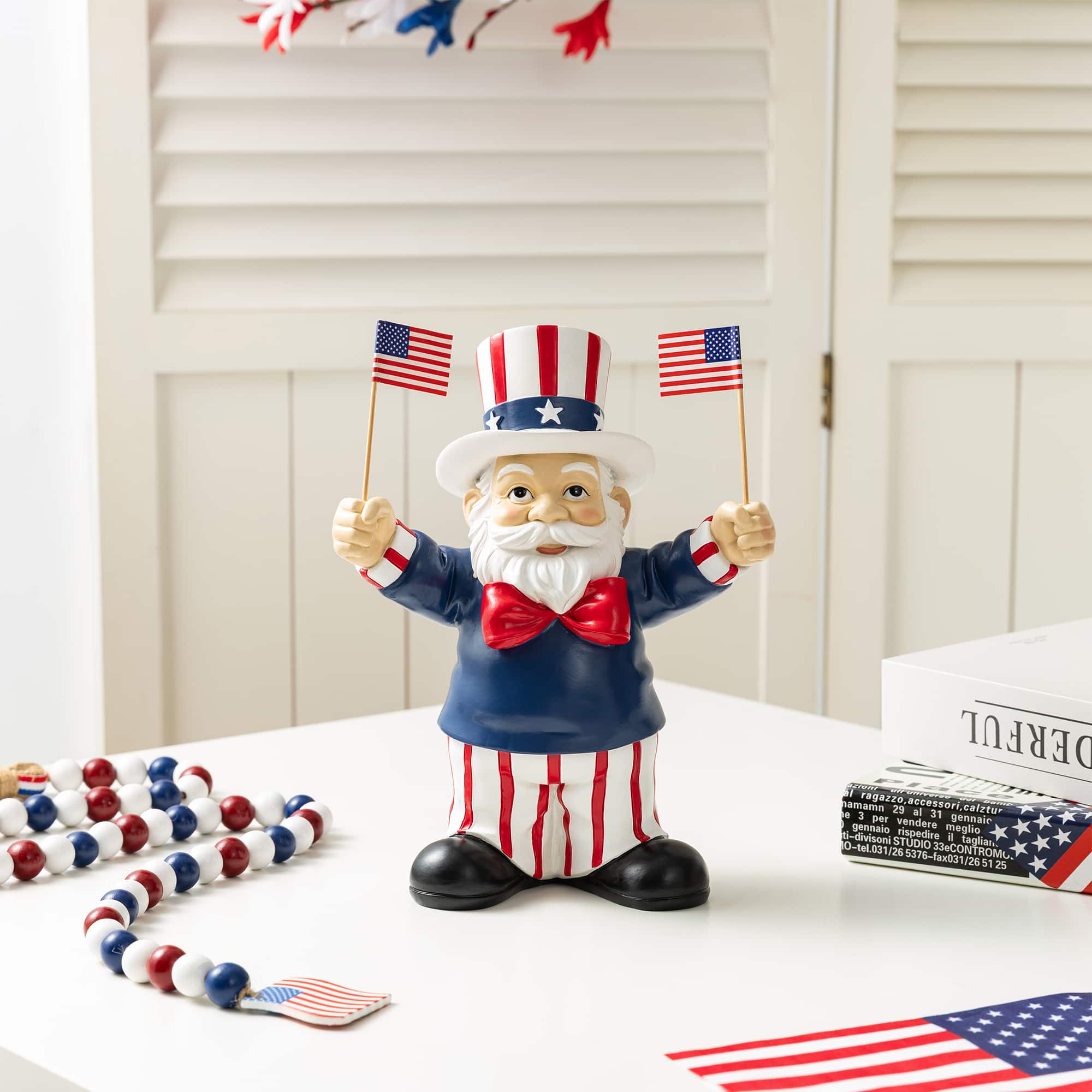 Glitzhome® 9" Patriotic Americana Polyresin Santa Holding Flags Table Decor